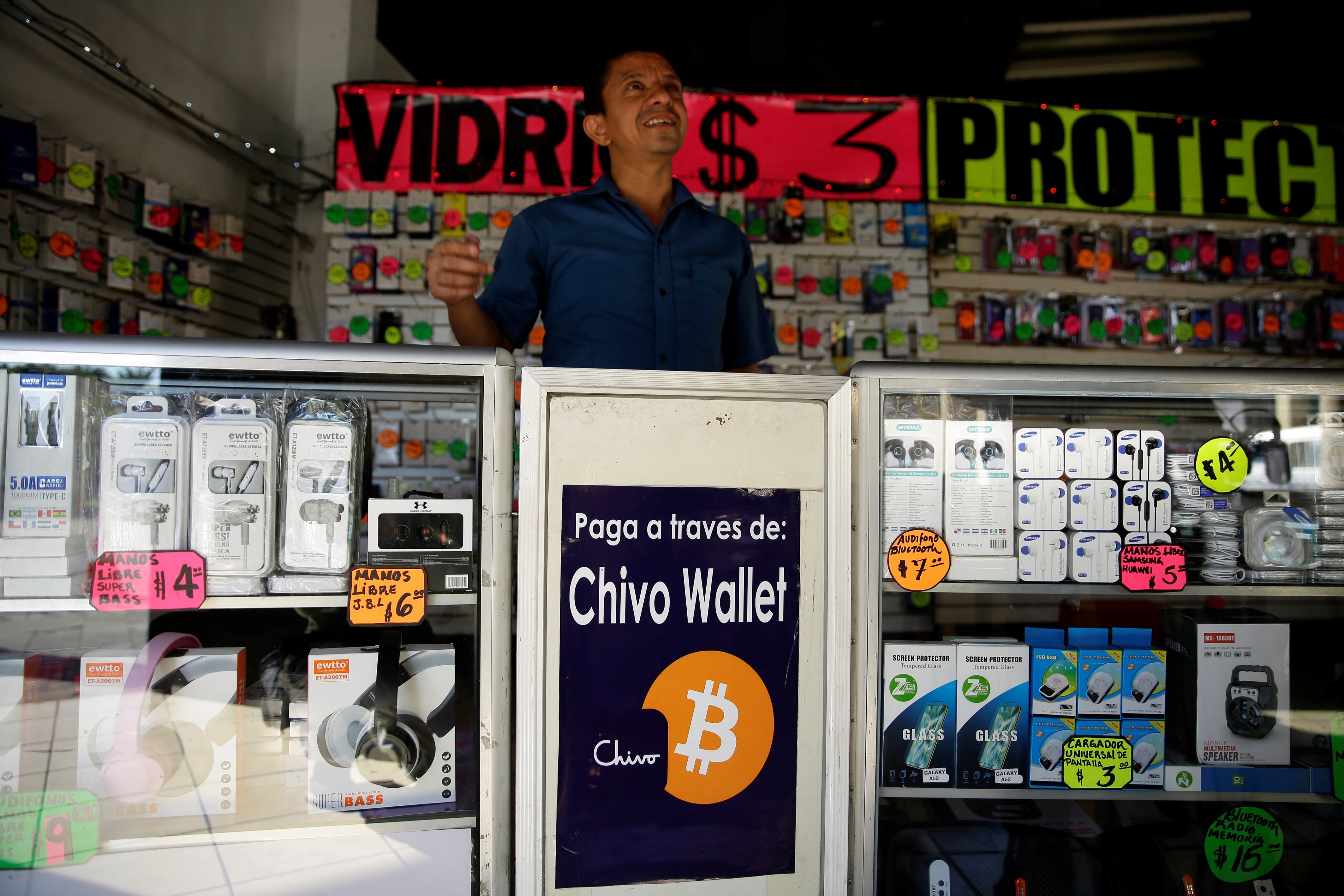 A man prepares to welcome customers in a business that accepts payments in cryptocurrency in San Salvador, El Salvador, on December 7. More energy, resources and intellectual capital could be directed towards crypto’s potential to lift up the developing world. Photo: EPA-EFE