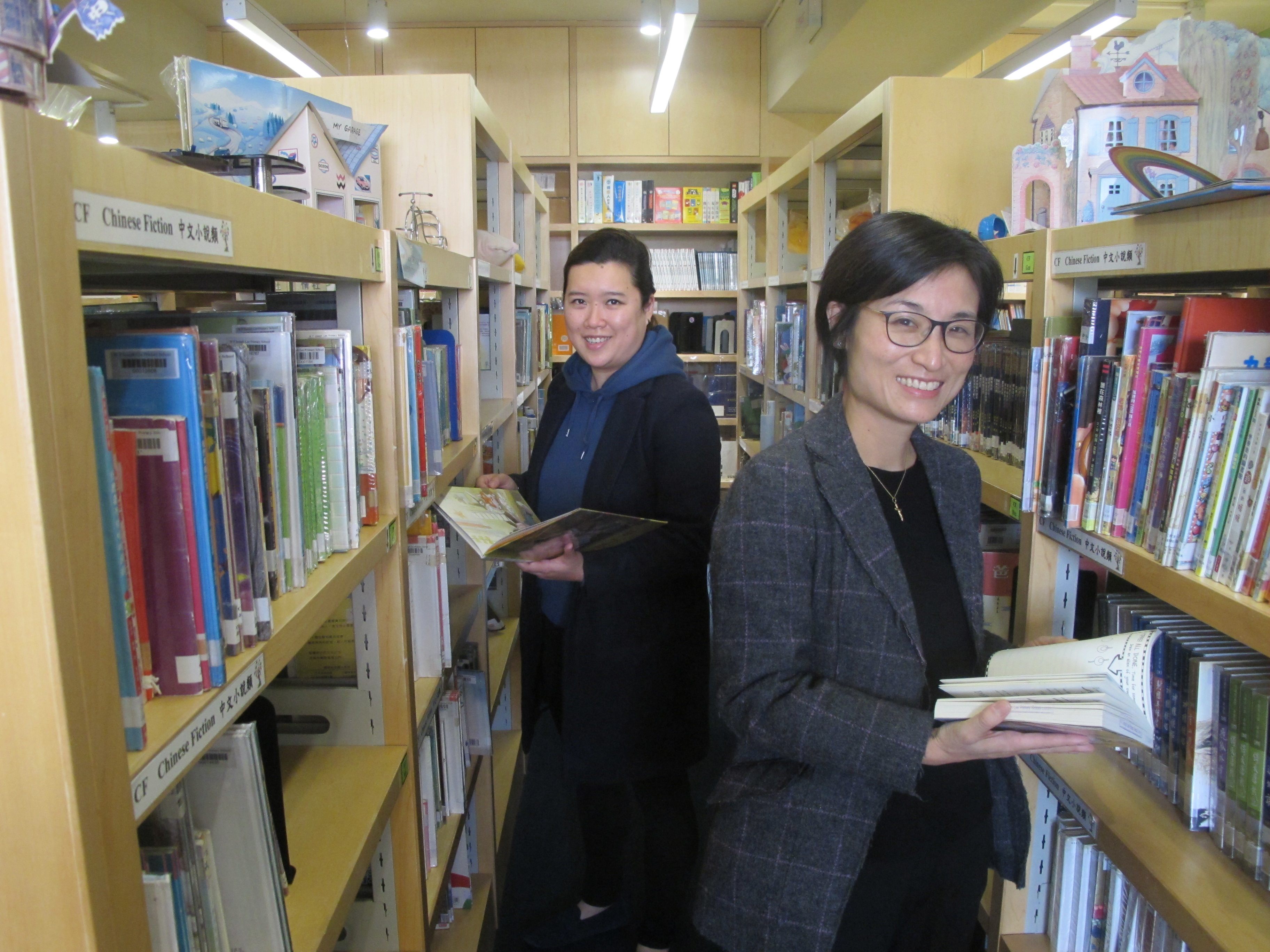 Wofoo Social Enterprises’ senior project manager Phoebe Tak-yan Wan (left) and director Christina Maisenne Lee at WF Joseph Lee Primary School’s library. Photo: SCMP