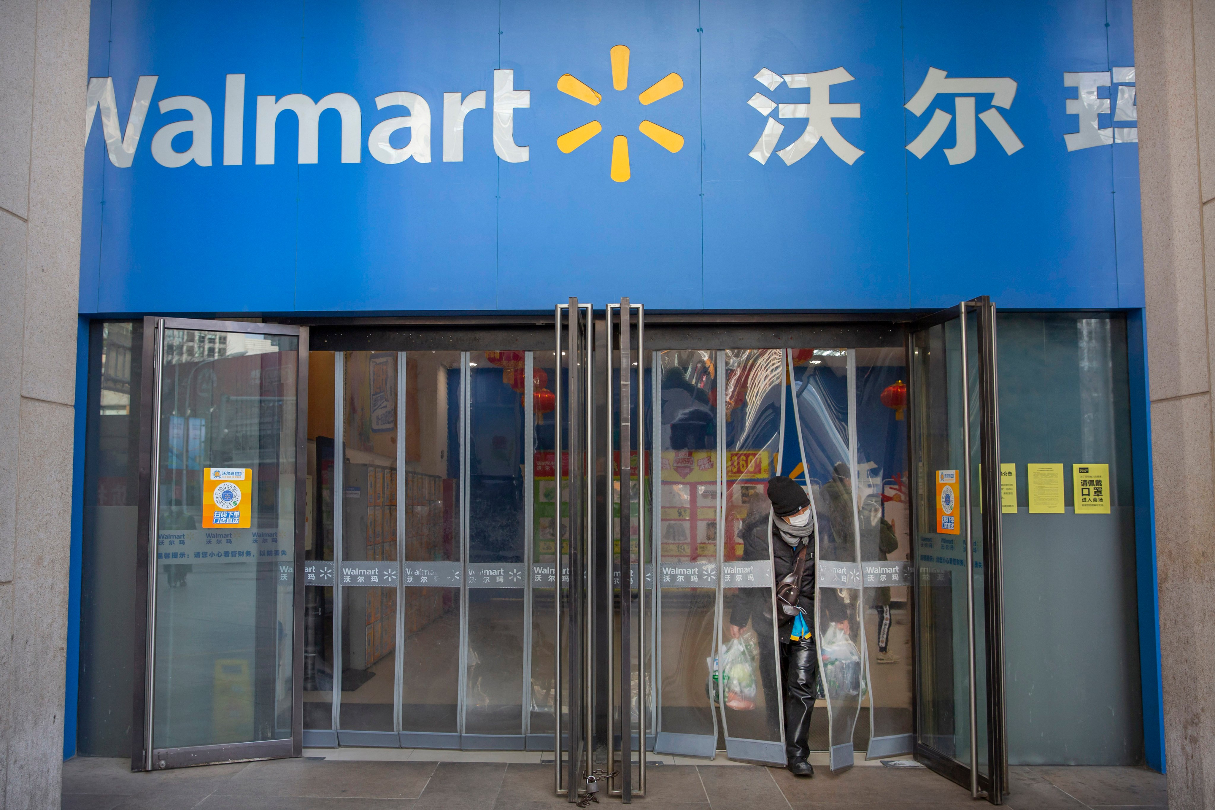 A woman wearing a mask is pictured at a Walmart grocery store in Beijing. In a statement on its website, China’s CCDI accused Sam’s Club of boycotting Xinjiang products. Photo: AP