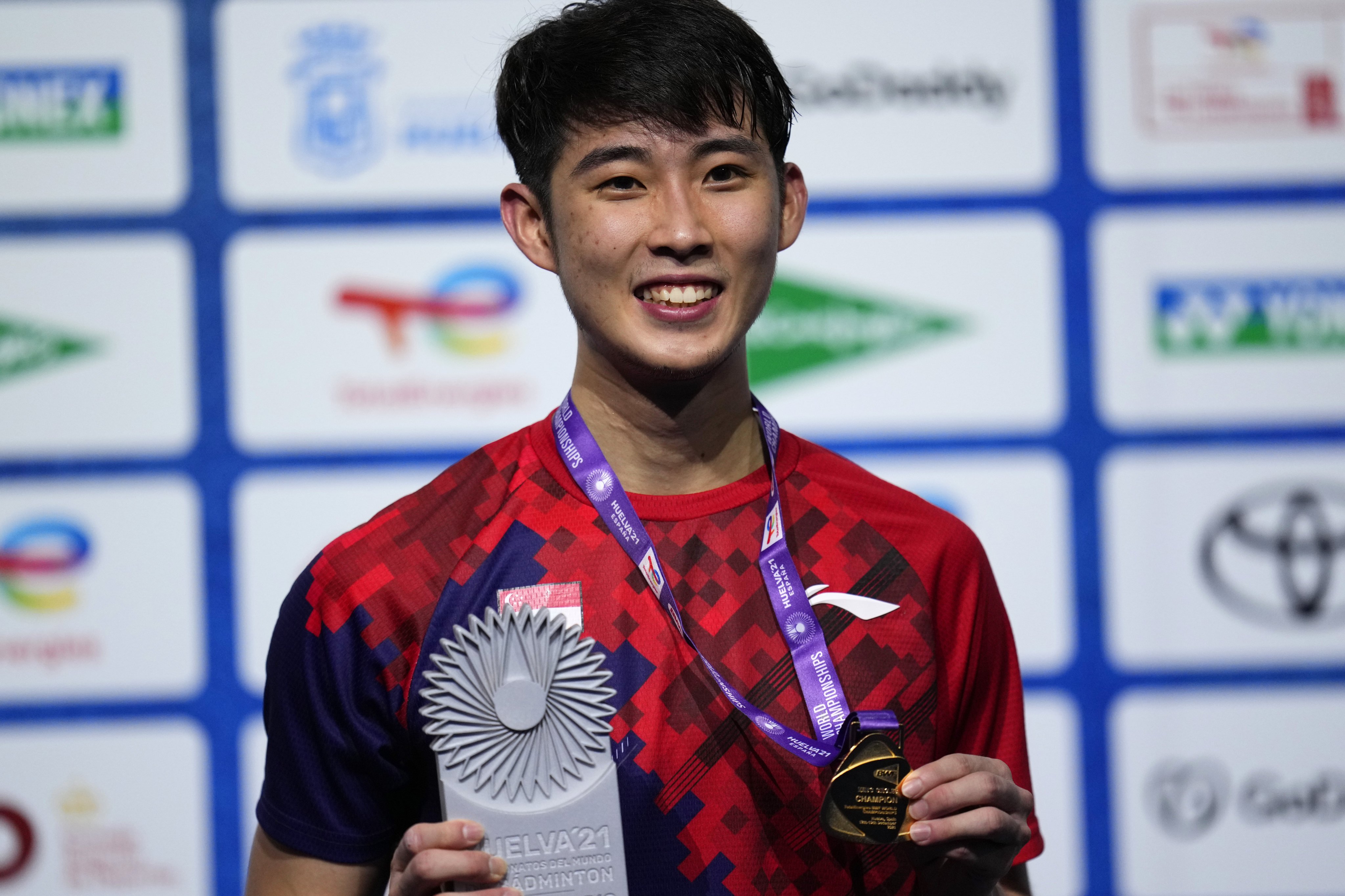 Singapore’s Loh Kean Yew with his gold medal after beating Kidambi Srikanth of India in the men’s singles badminton final event at the BWF World Championships in Huelva in Spain. Photo: AP   