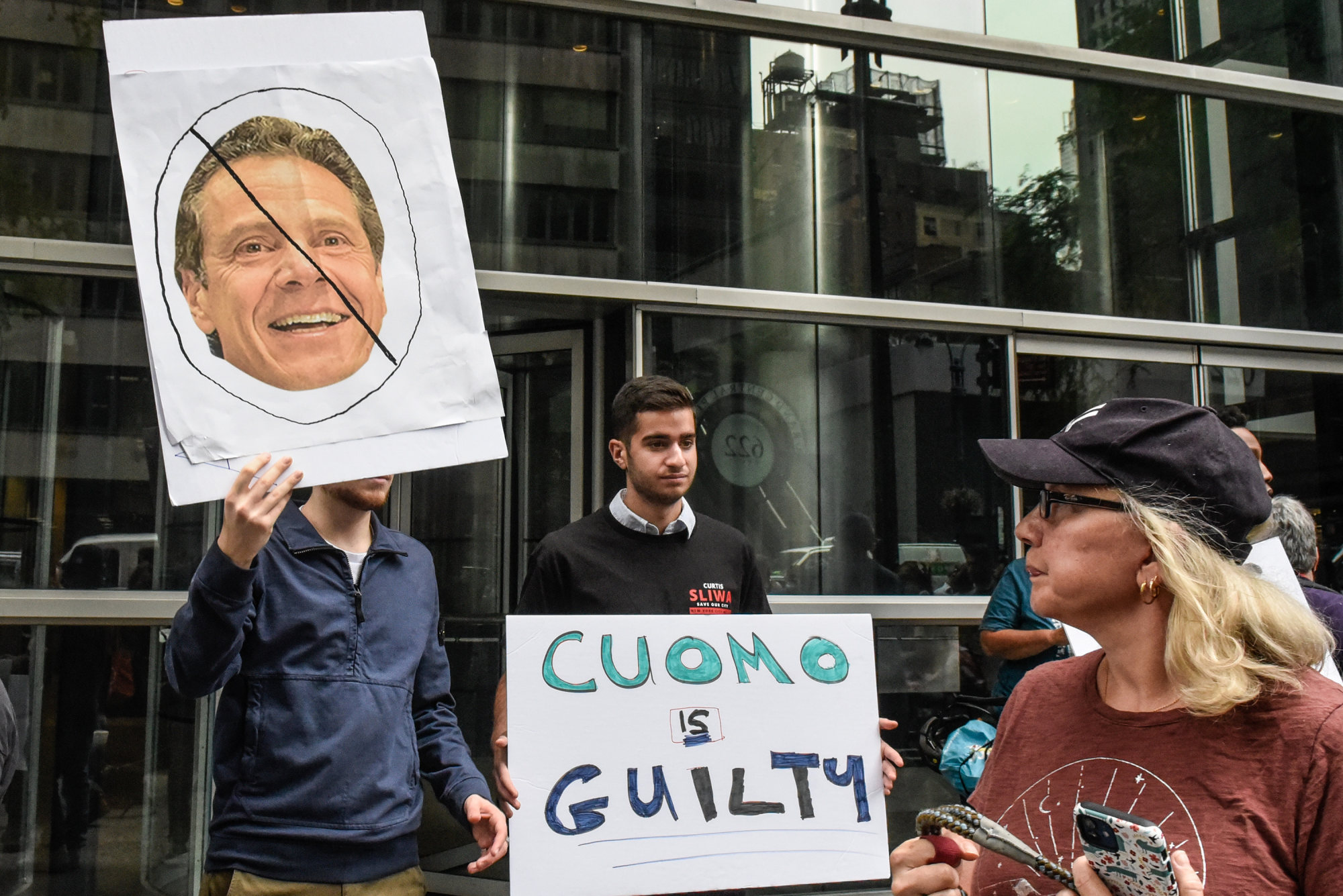 People participate in a protest against then Governor Andrew Cuomo in New York in August. Photo: TNS