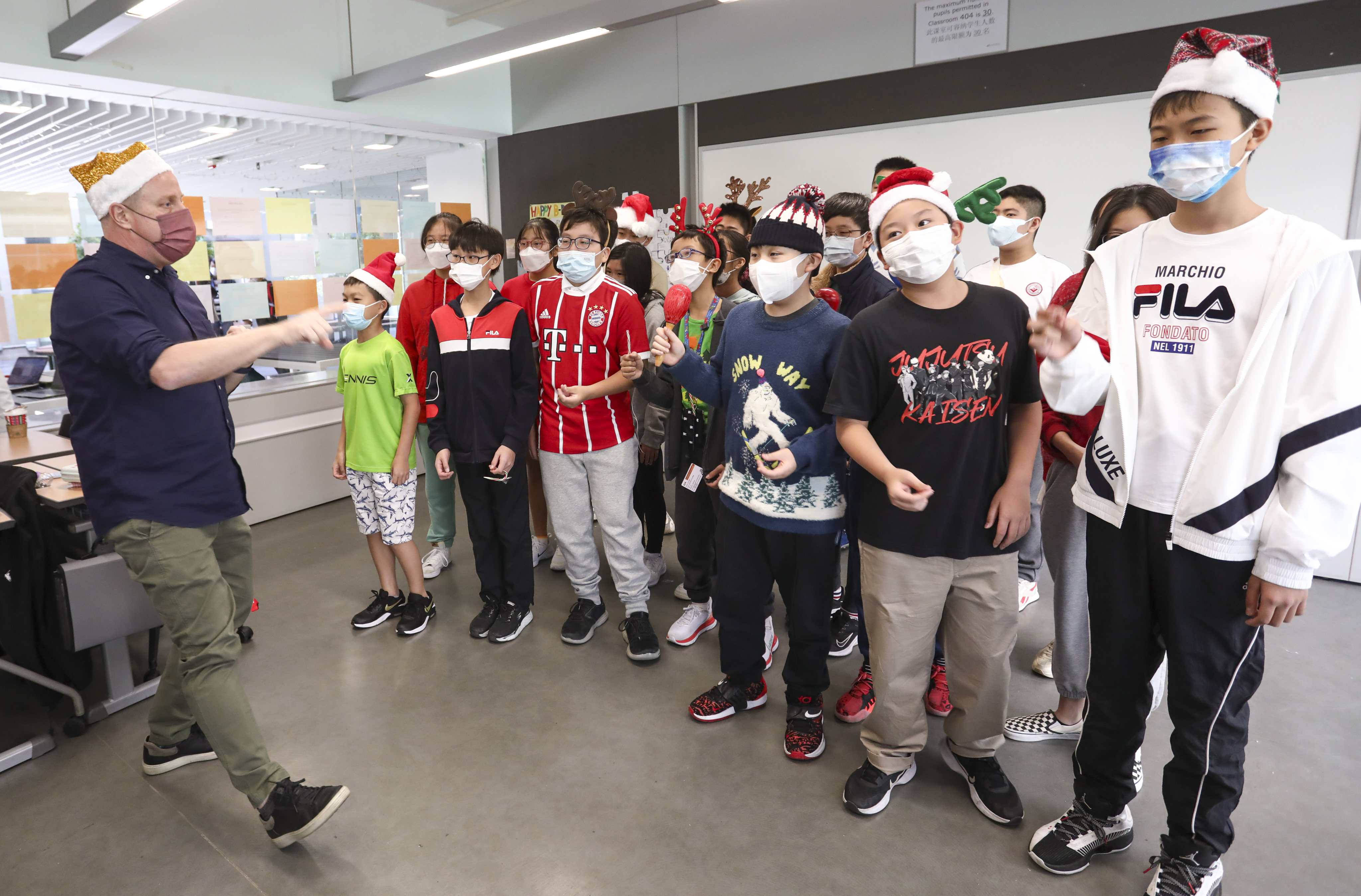 Students dress up for Christmas activities to raise money for OSC at Singapore International School (Hong Kong). Photo: SCMP/ Jonathan Wong