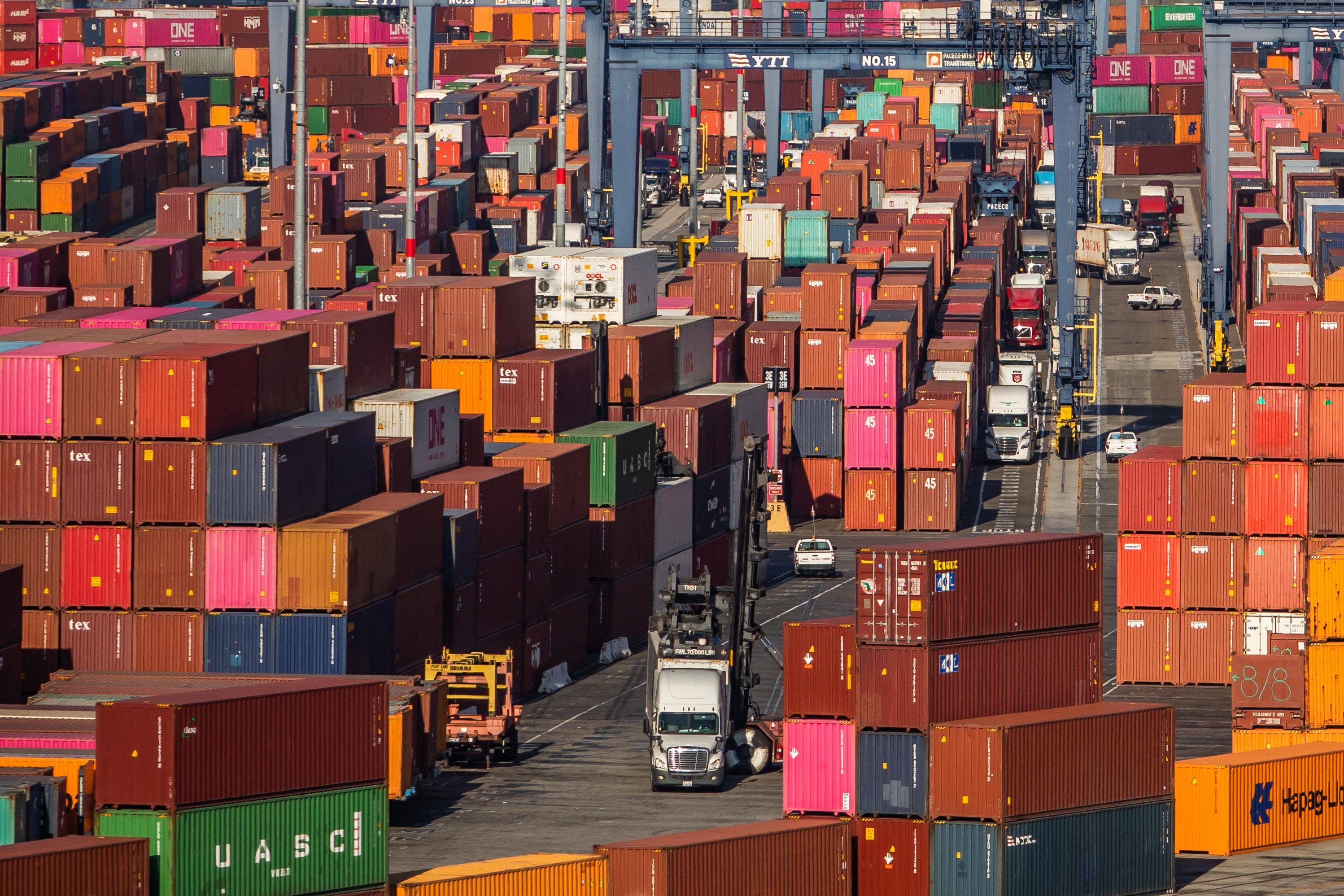 Shipping containers and trucks at the Port of Los Angeles in San Pedro, California, on November 17. Port congestion has led to shortages and US inventories remain low and in need of replenishing. Photo: AFP