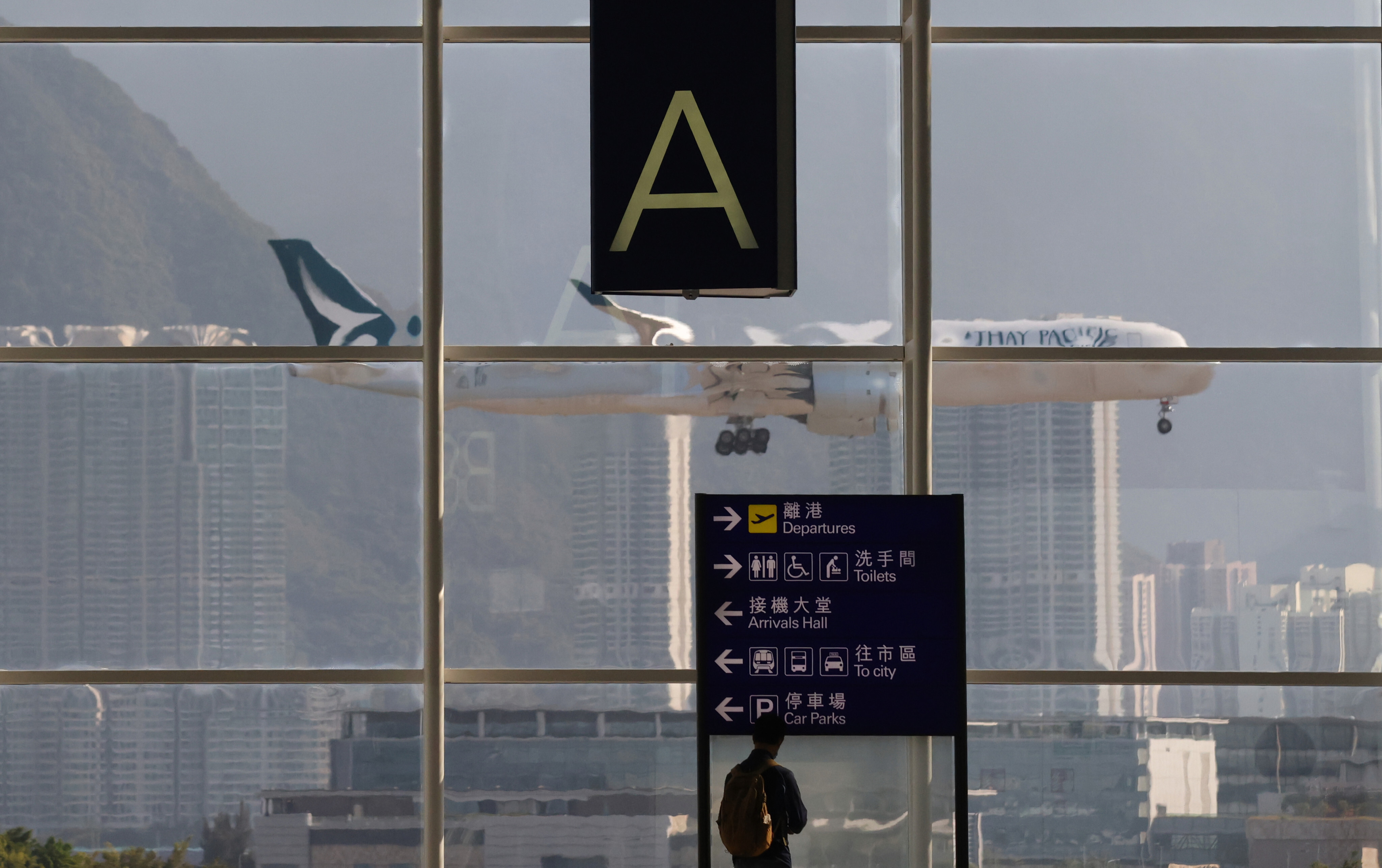 A Cathay Pacific plane lands at Hong Kong International Airport on November 14, 2021. The Hong Kong flag-carrier’s struggles during the pandemic have been emblematic of the entire sector as airlines scramble to keep up with shifting vaccine and travel regulations. Photo: May Tse