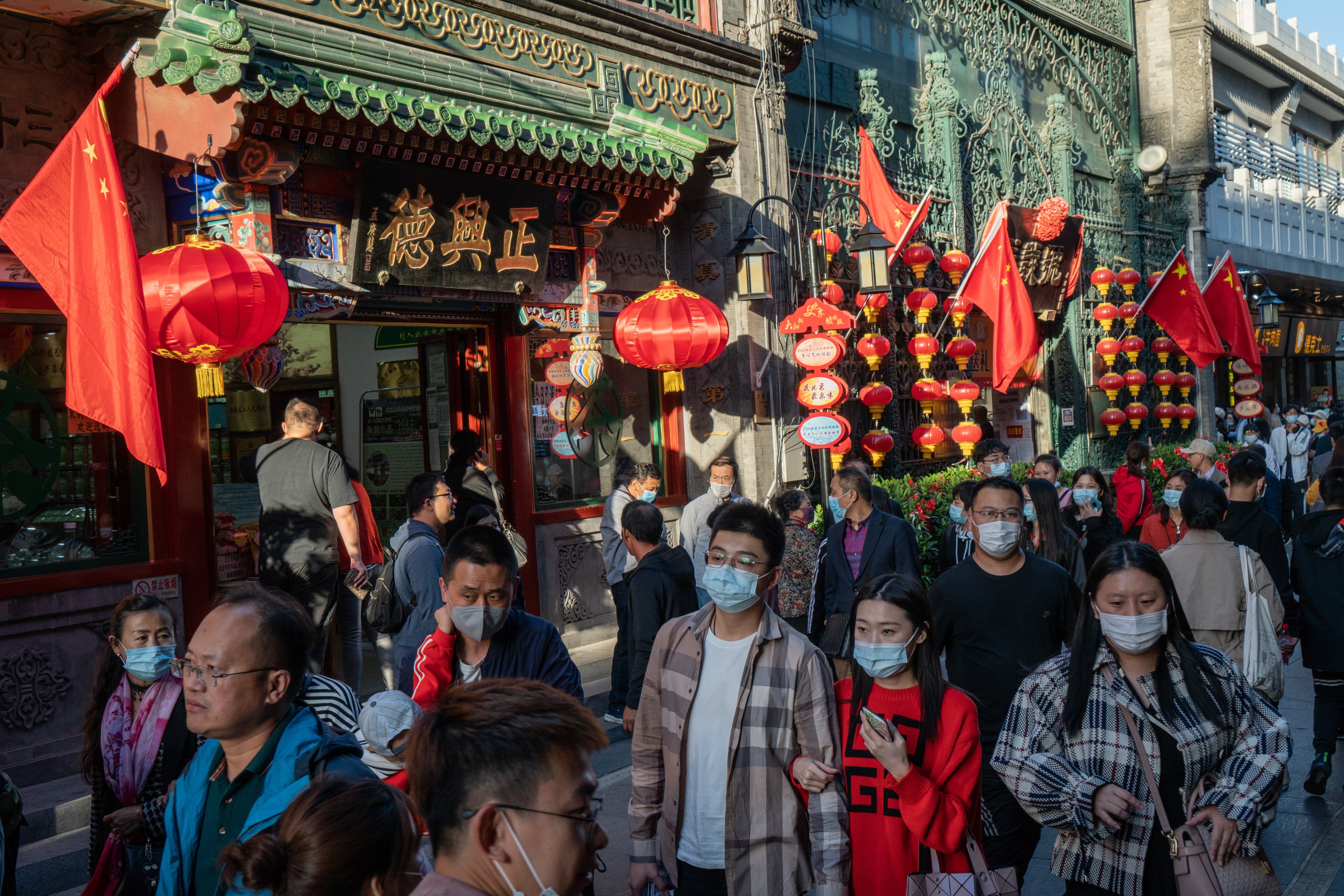 Visitors walk through the Qianmen area of Beijing on October 4, 2020. The success or failure of China’s goal of doubling its economy by 2035 hinges on its ability to increase its middle-class population and consumption. Photo: Bloomberg