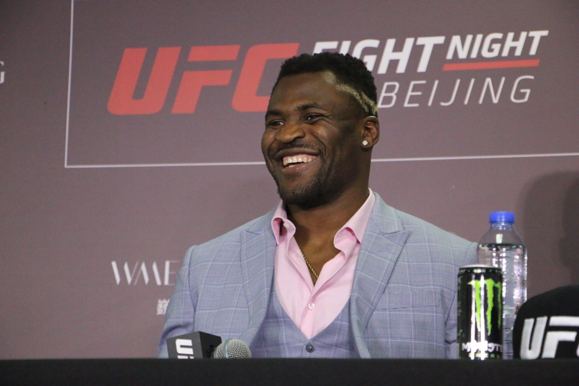 Francis Ngannou smiles at his post-fight press conference
