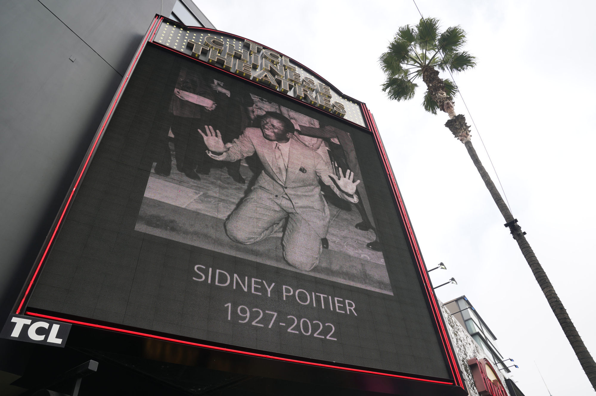 A theatre marquee displays a picture of the late actor Sidney Poitier. Photo: AP