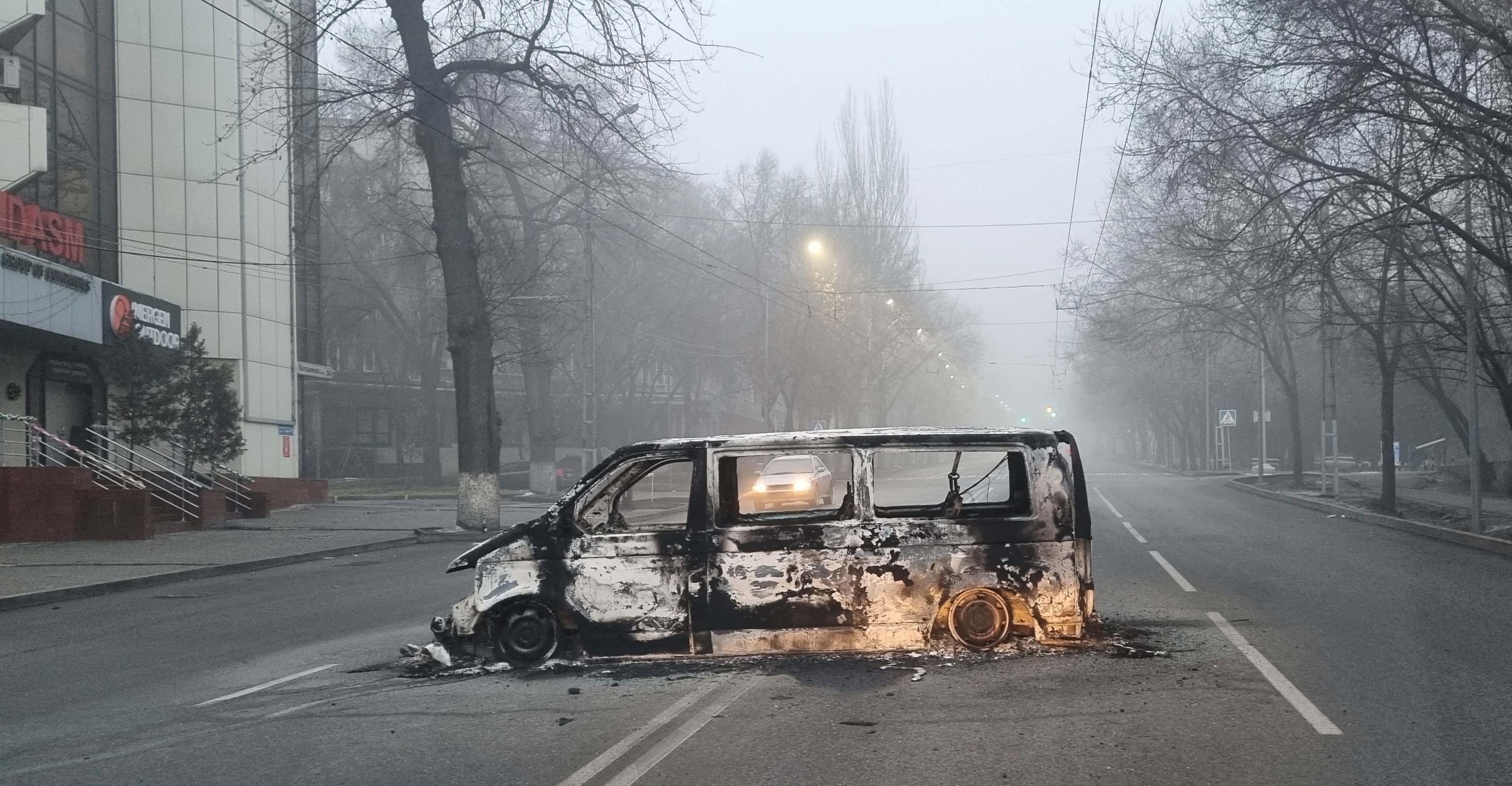 A vehicle that was burned during the protests triggered by fuel price increases is seen on a road in Almaty, Kazakhstan. Photo: Reuters