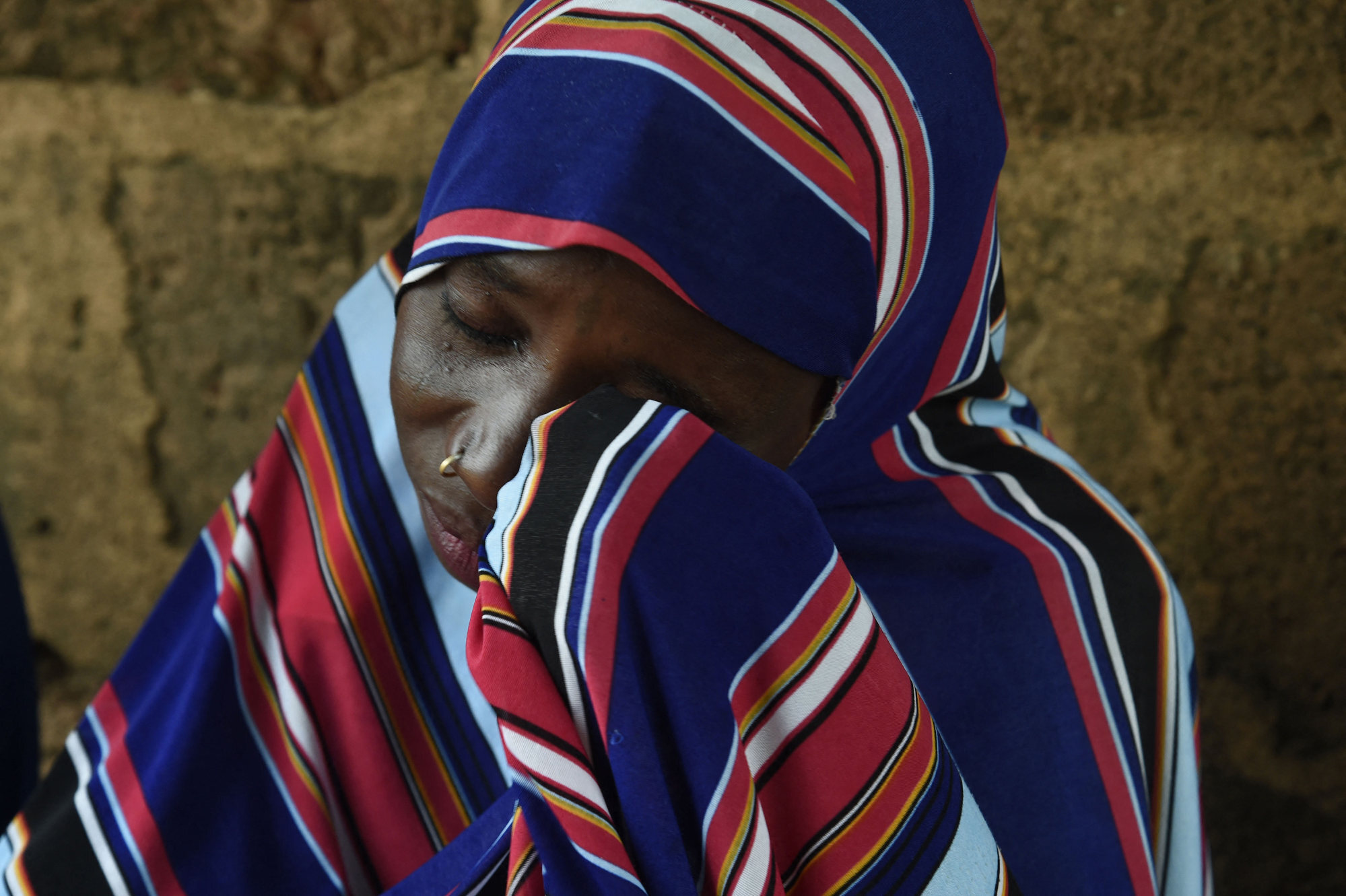 Twenty-five-year-old mother Maryam Aliyu cries while talking about her ordeal with bandits last year. Photo: AFP
