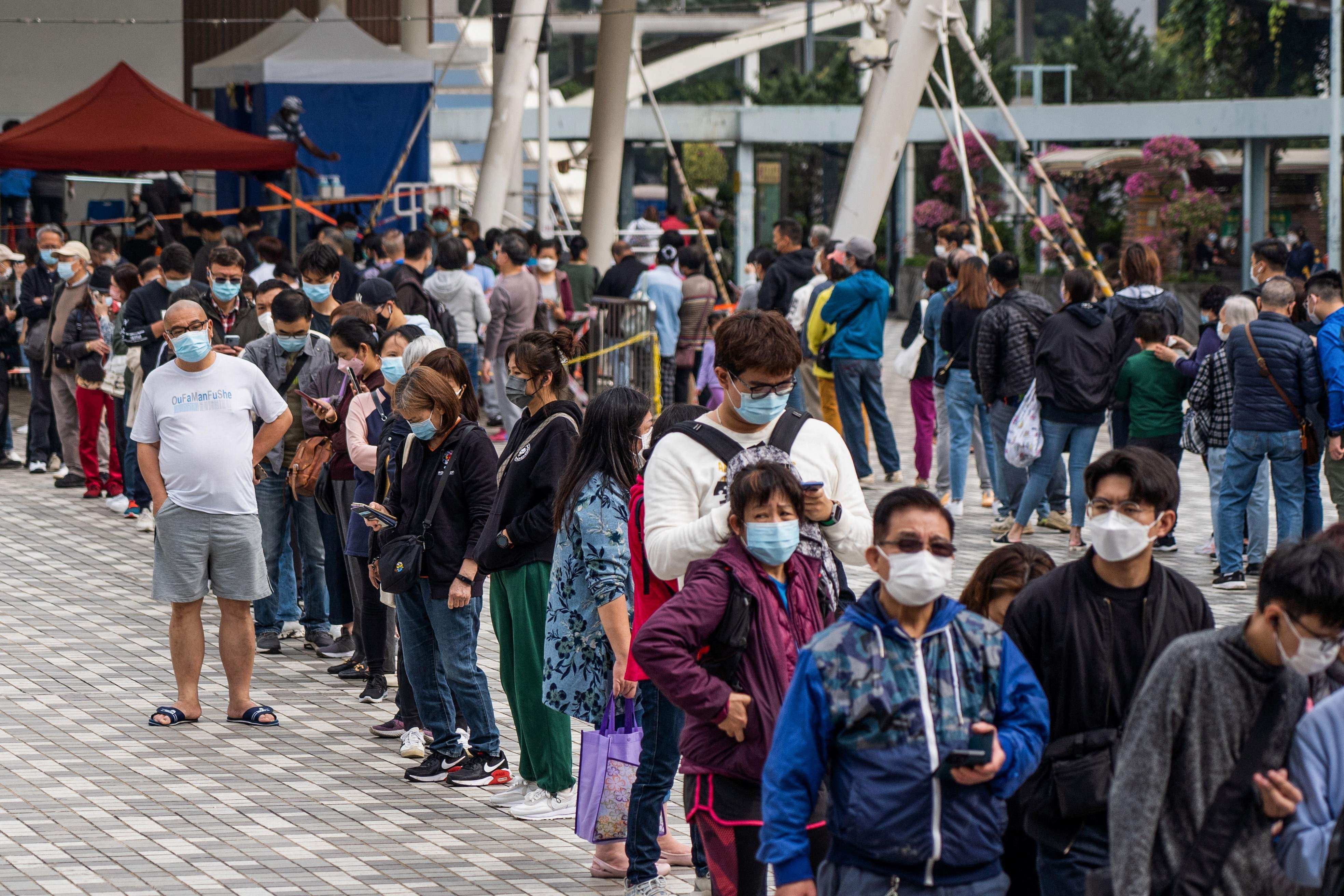 People queue outside a temporary community testing centre which provides free Covid-19 testing in the Wong Tai Sin area of Hong Kong on January 9. Photo AFP
