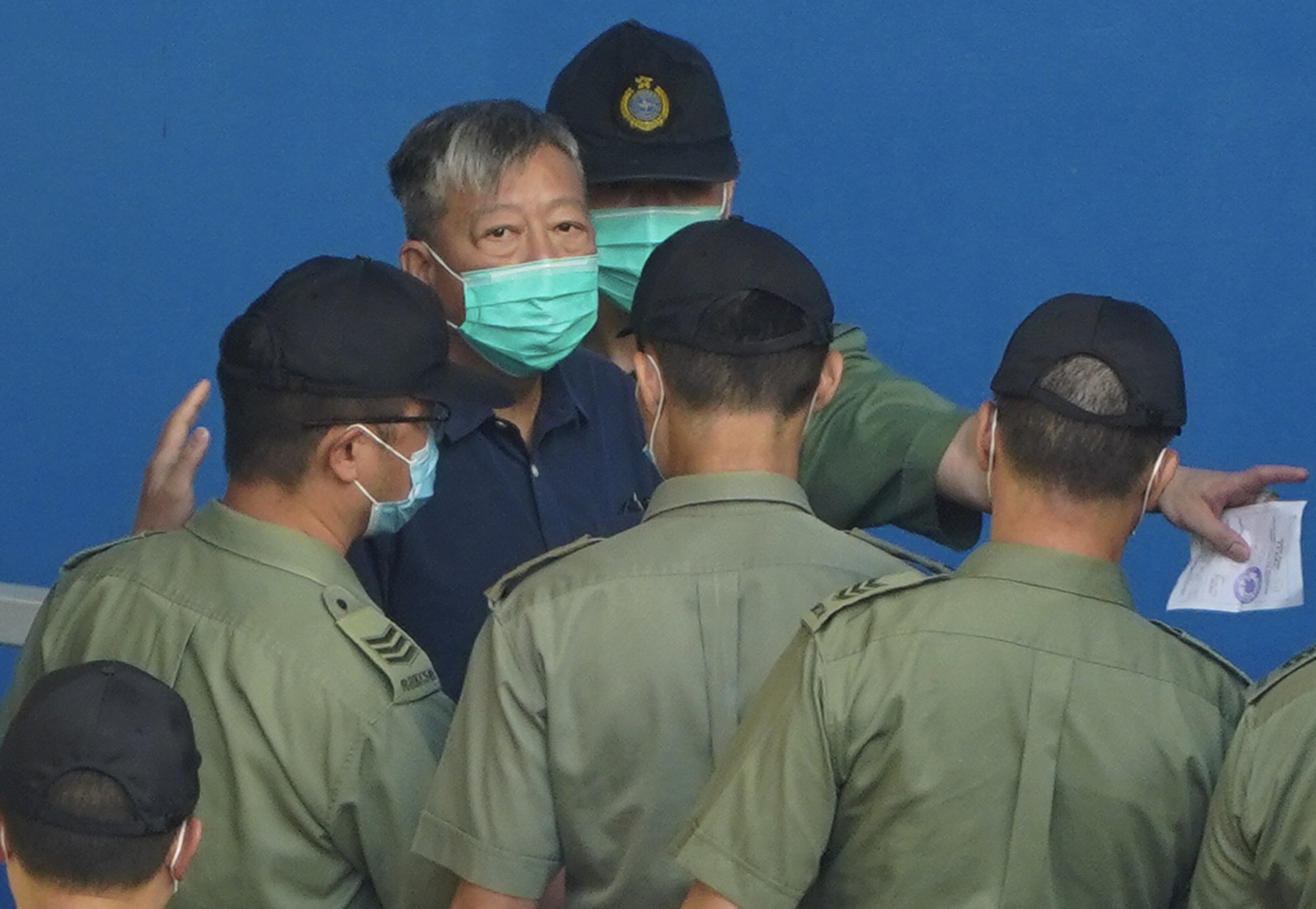 Lee Cheuk-yan departs pictured in custody in May last year. Photo: Handout
