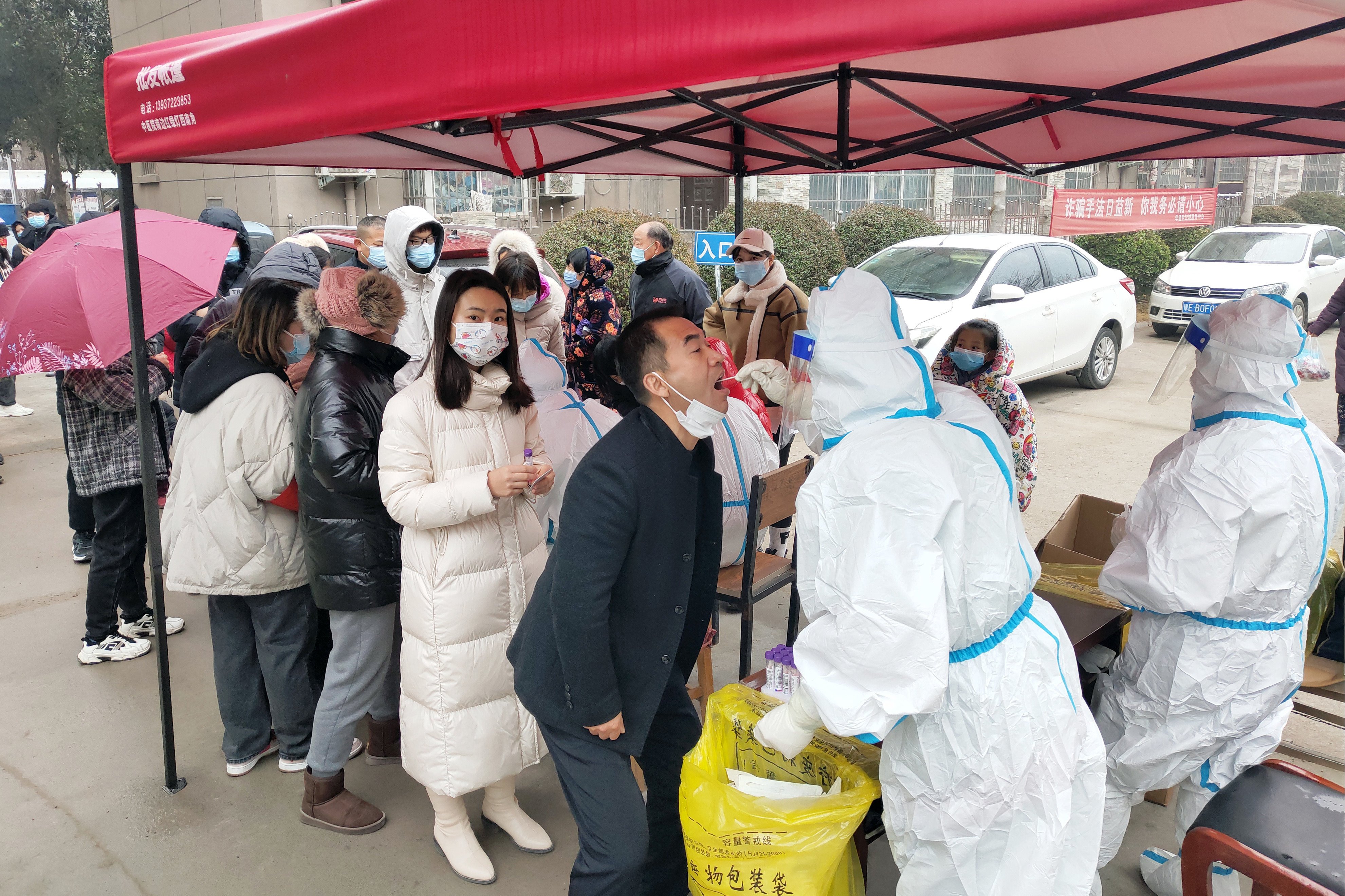 Residents in Anyang, Henan province, queue for a coronavirus test on Monday. Photo: DPA