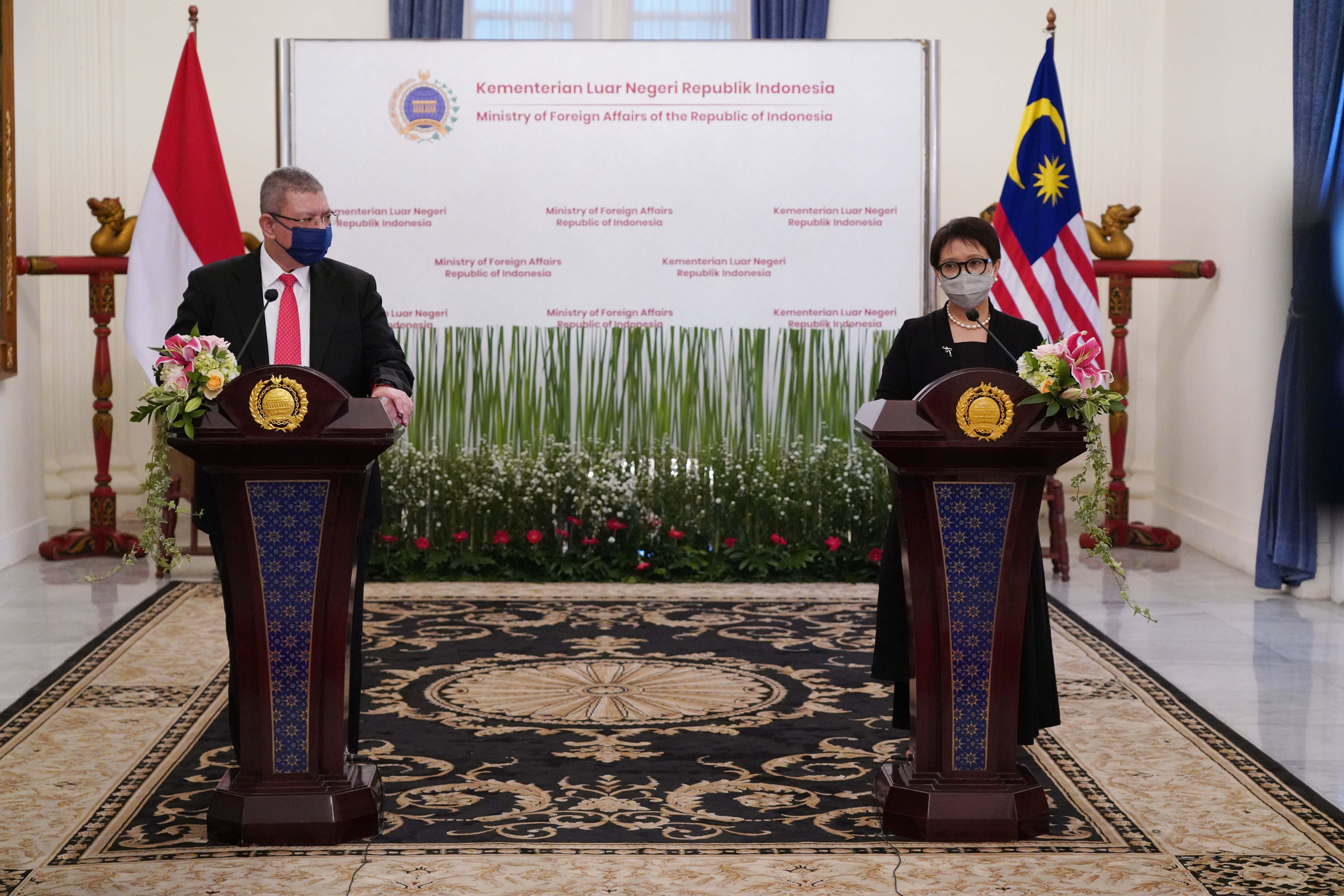 A meeting between Malaysia’s Foreign Minister Saifuddin Abdullah and his Indonesian counterpart Retno Marsudi in October 2021. Photo: AP