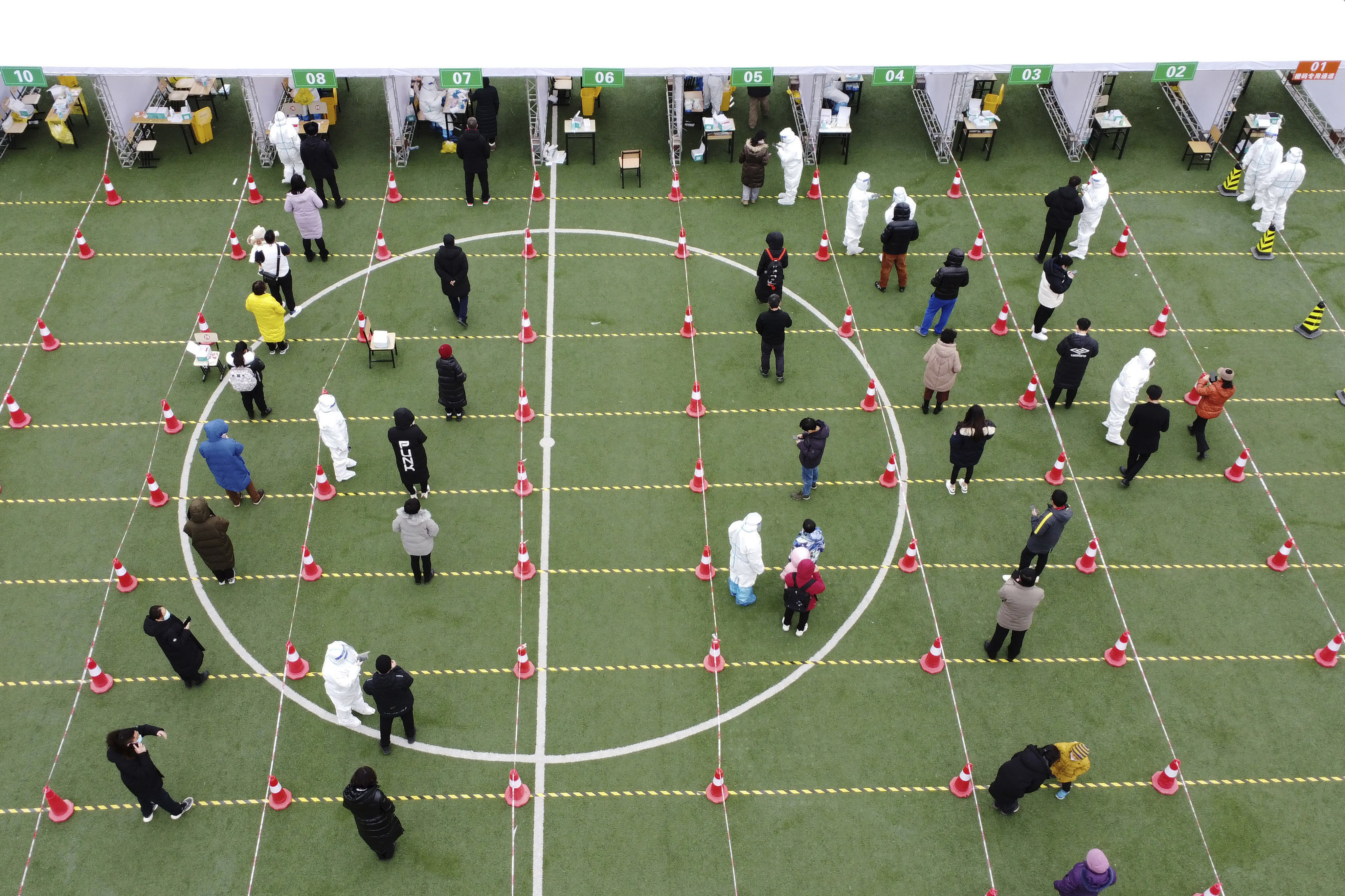 Residents line up for a second round of Covid-19 testing in Tianjin on Wednesday. Photo: AP