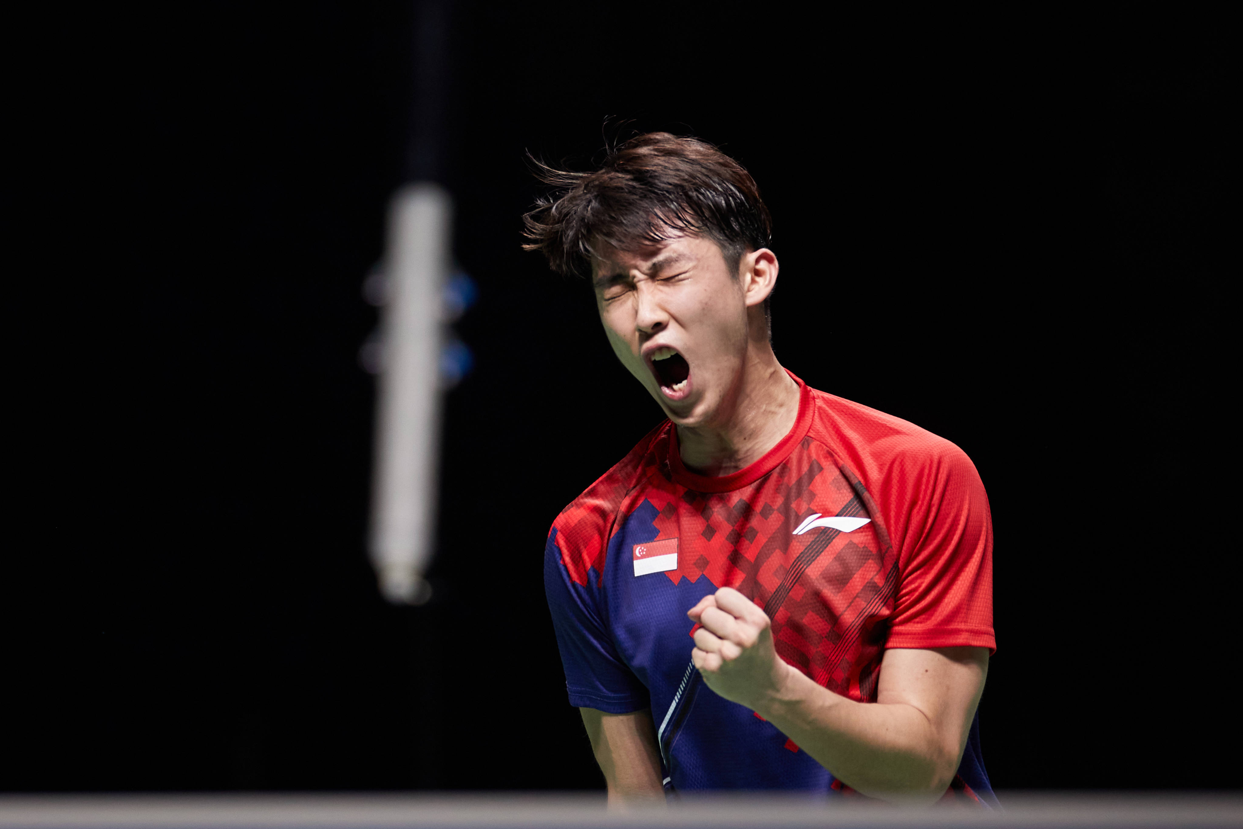 Loh Kean Yew of Singapore celebrates scoring a point during the men’s singles final at the BWF World Championships 2021 in Huelva, Spain. Photo: Xinhua