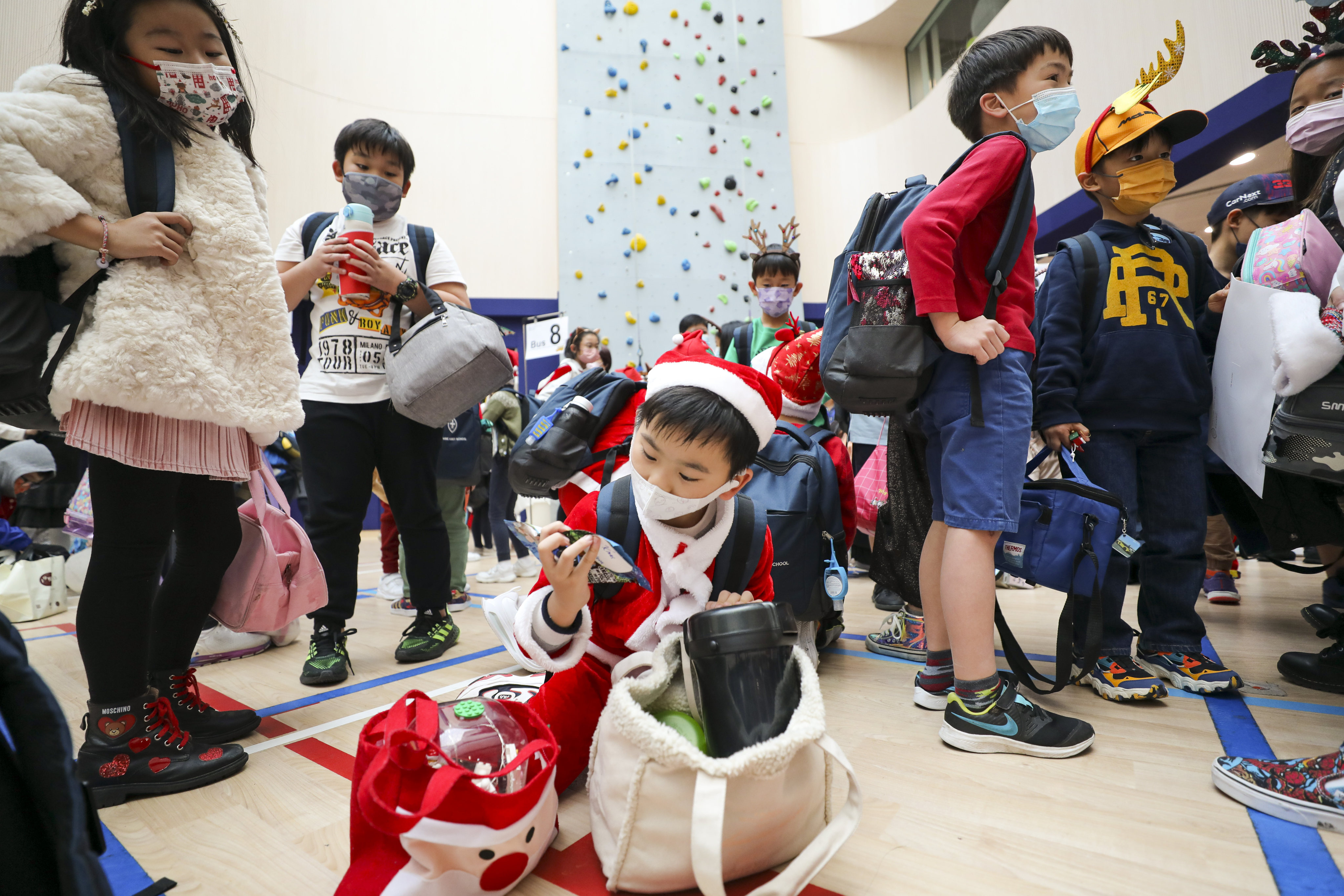 Wycombe Abbey School students dress up in Christmas outfits to raise money for Operation Santa Claus. Photo: Xiaomei Chen