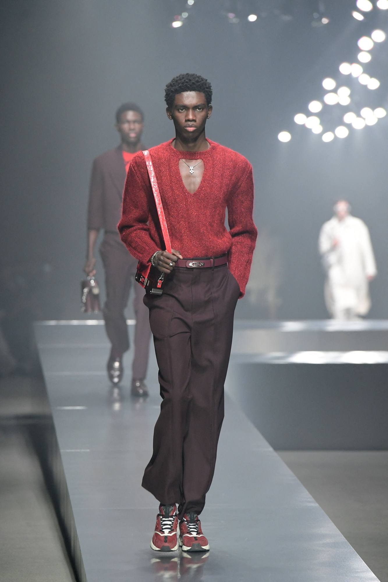 MILAN - JANUARY 15: Man with orange shirt and red Louis Vuitton