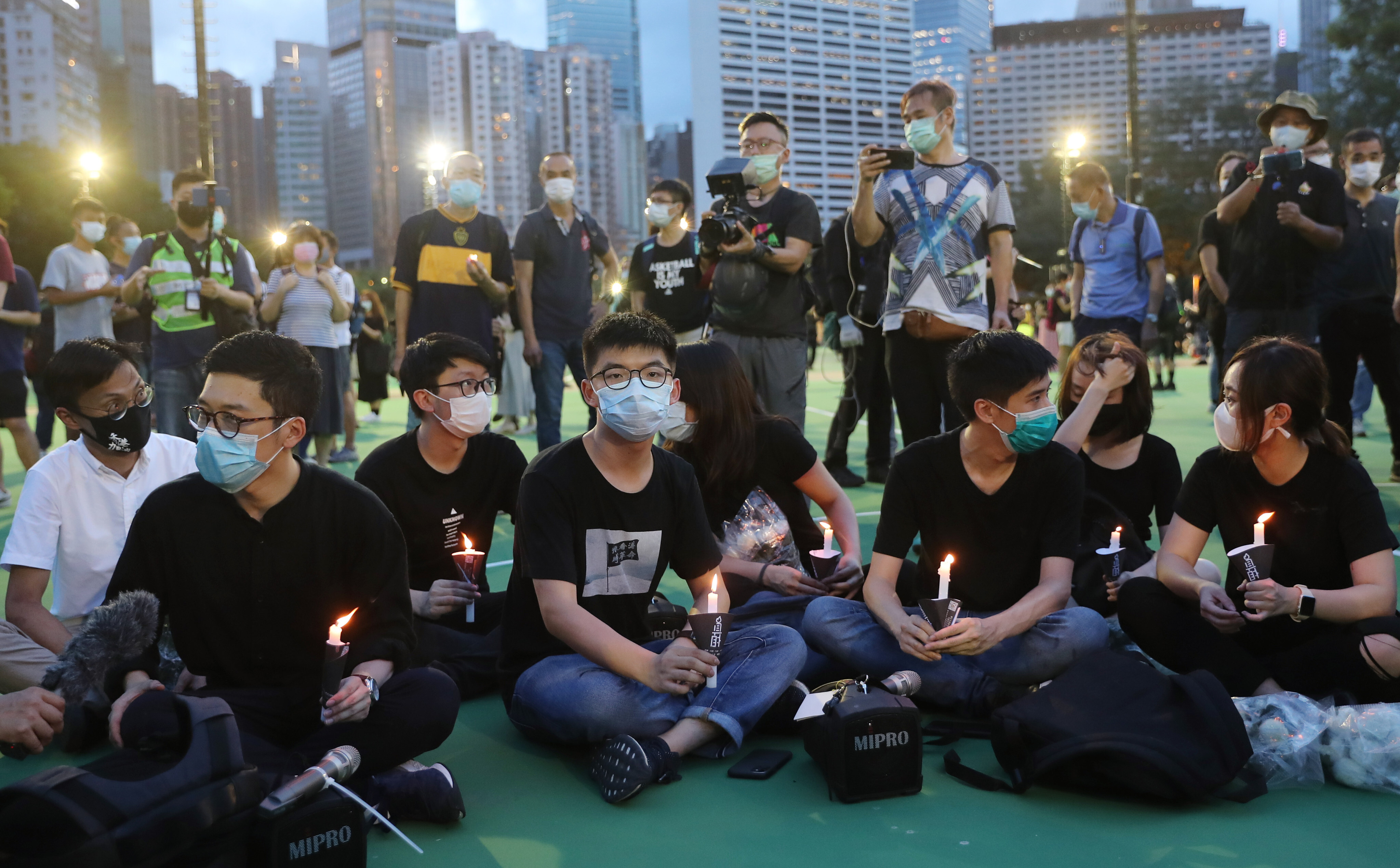 Opposition activist Joshua Wong (centre) at the banned Tiananmen Square vigil in 2020. Photo: Sam Tsang