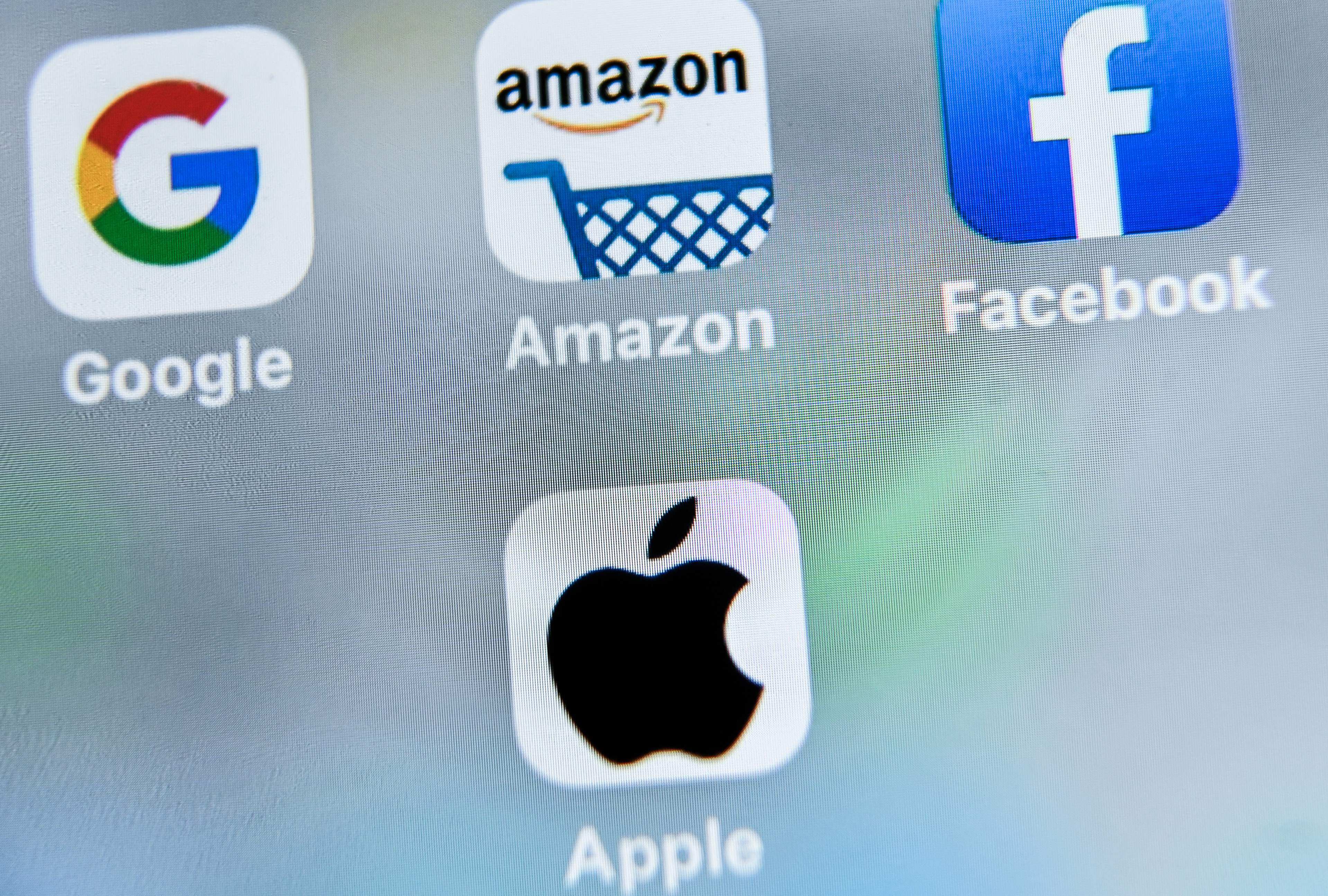 The apps for US multinational technology giants Google, Amazon, Facebook and Apple seen on August 27, 2019. Platform operators Apple and Google are under pressure from lawmakers over the control they exert over their ecosystems, which the tech firms argue allows them to better protect users. Photo: AFP