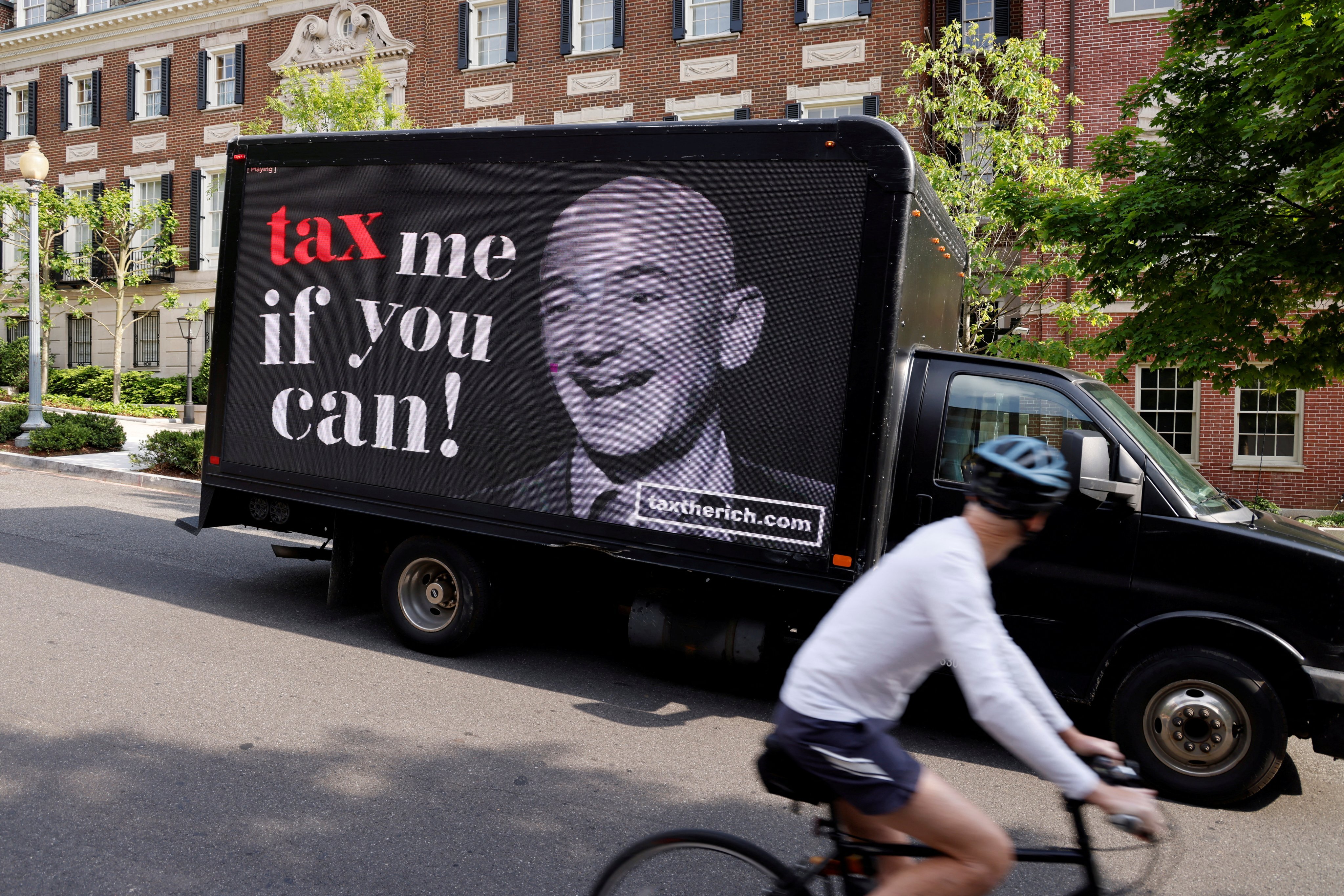 A video protest sign on a truck paid for by the Patriotic Millionaires drives past a mansion owned by Amazon founder Jeff Bezos in Washington. File photo: Reuters
