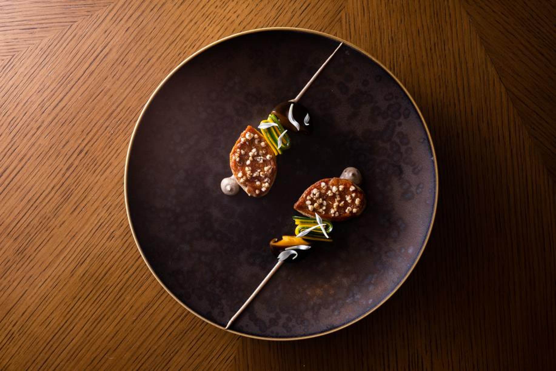 Chef Richard Ekkebus’ quail and fermented mushrooms at Amber restaurant in The Landmark, which retained its two Michelin stars and earned a Michelin green star. Photo: Amber