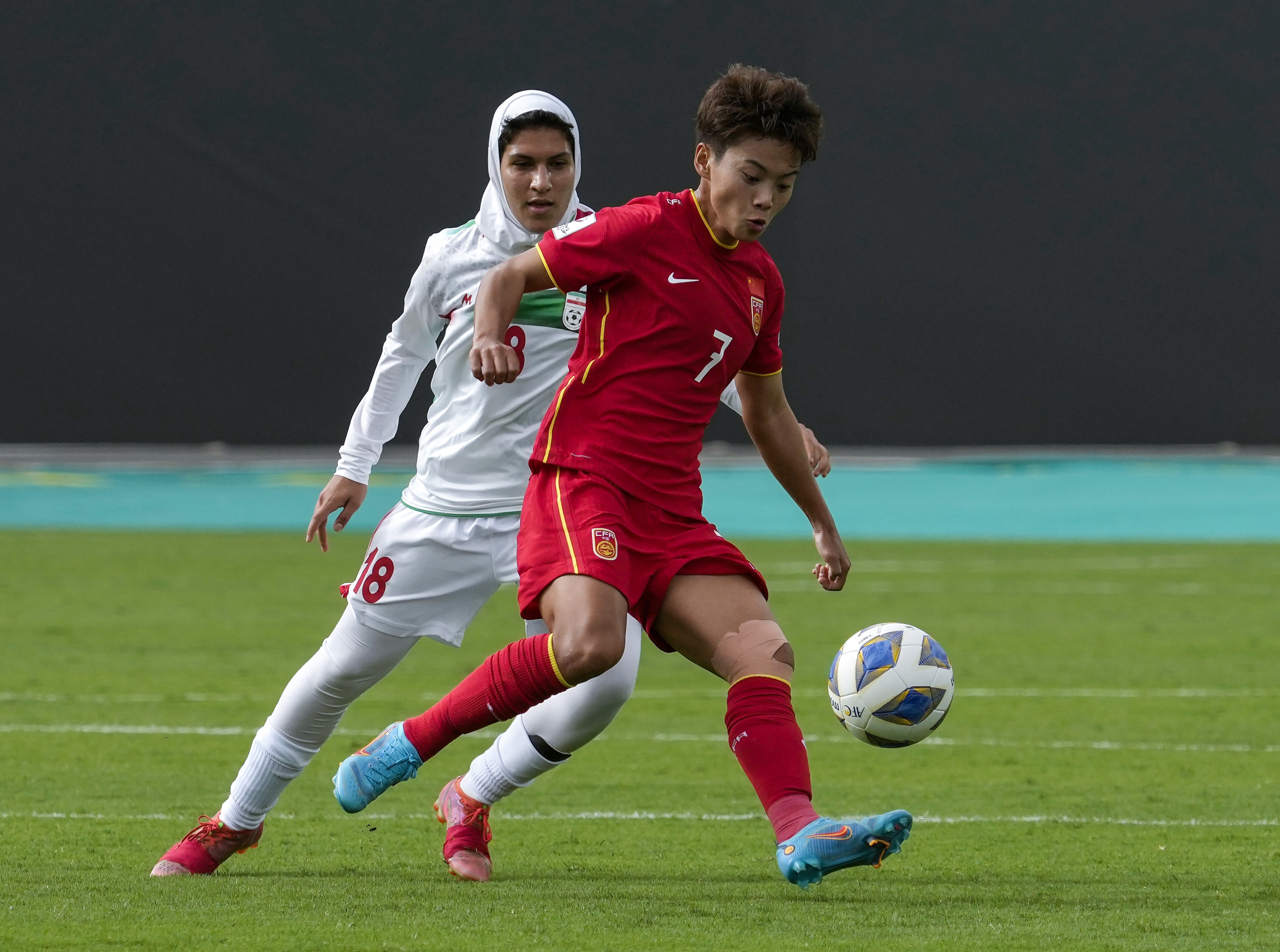 Wang Shuang controls the ball during the AFC Women’s Asian Cup 2022 against Iran in Mumbai. Photo: AP