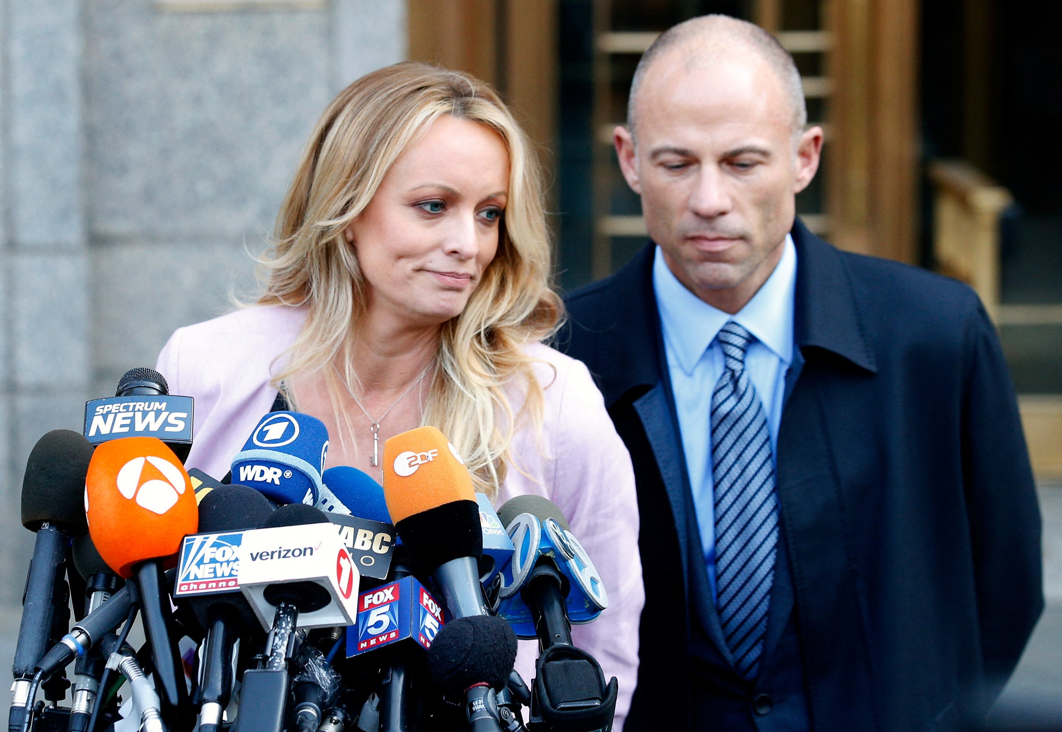 Adult film actress Stephanie Clifford, also known as Stormy Daniels, speaks to media along with lawyer Michael Avenatti in New York in April 2018. Photo: Reuters