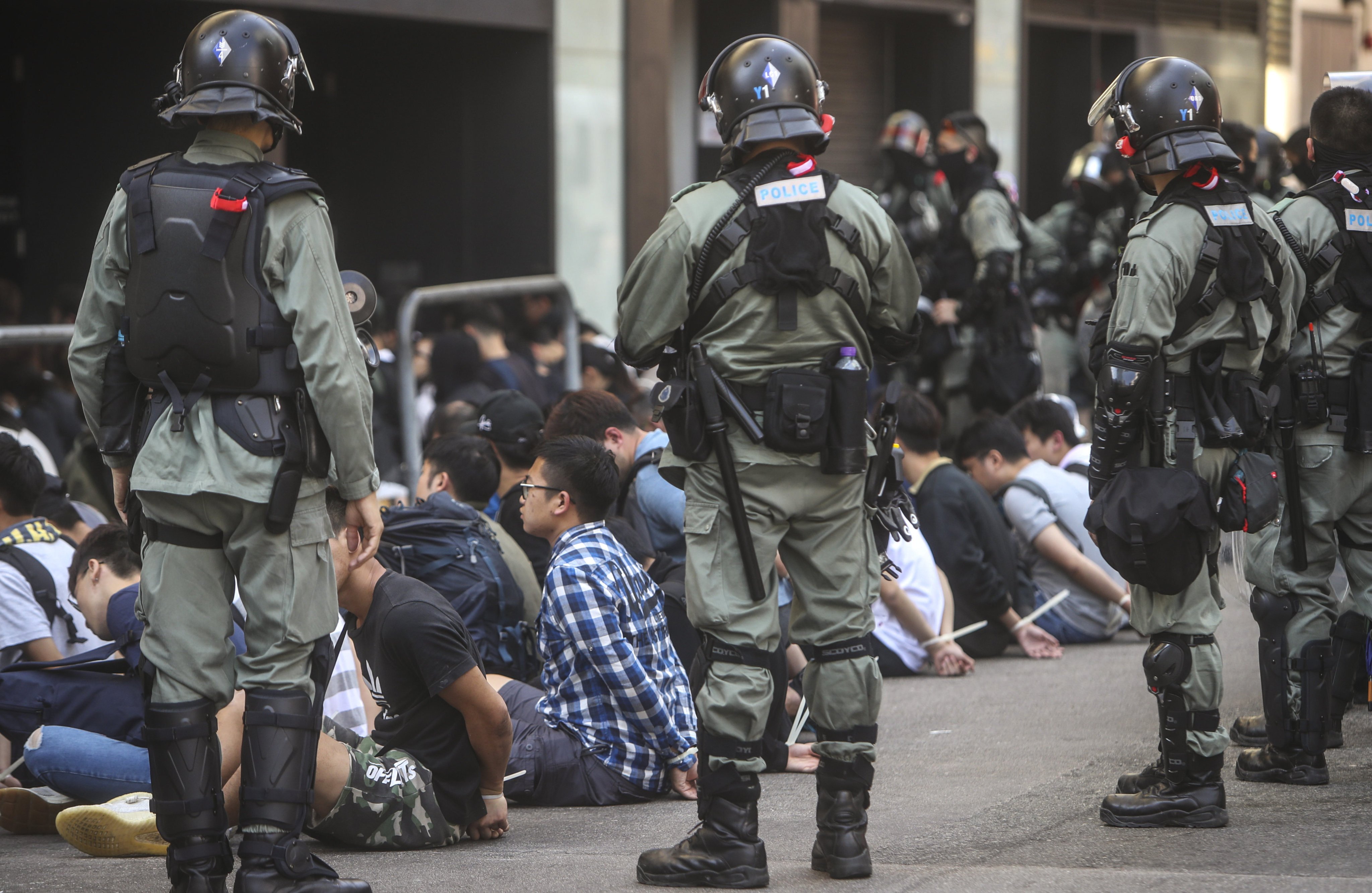 Riot police make arrests after clashes with protesters at Polytechnic University in Hung Hom in November 2019. Photo: Winson Wong