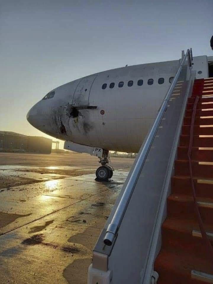 A damaged aircraft on the tarmac of Baghdad airport, after a rocket attack on Friday. Photo: via AP