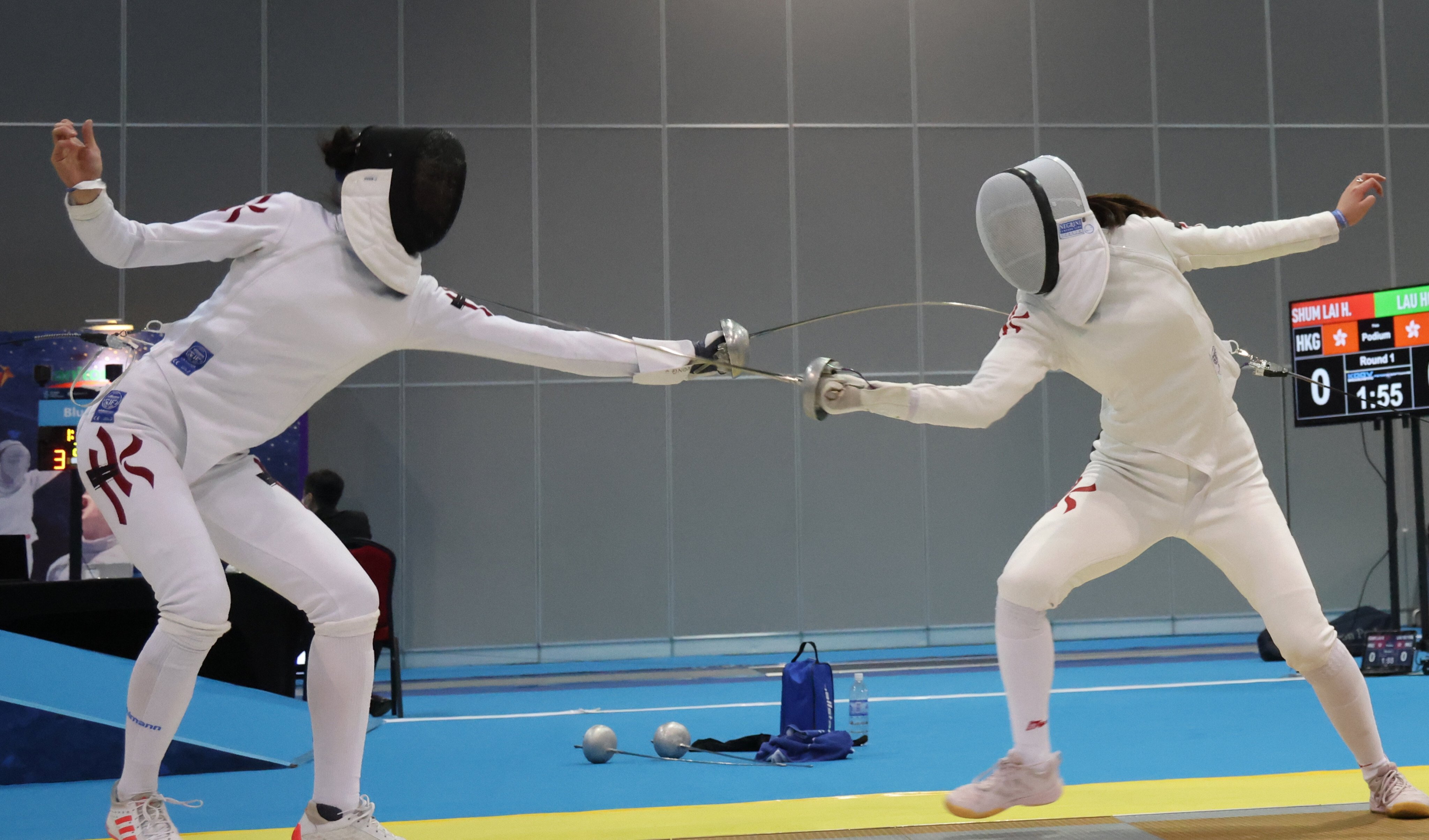 Hong Kong women’s epee fencer Vivian Kong Man-wai (left) in a game against Chan Wai-ling in the women’s epee event at Hong Kong Open Fencing at the AsiaWorld-Expo. Photo: SCMP / May Tse   