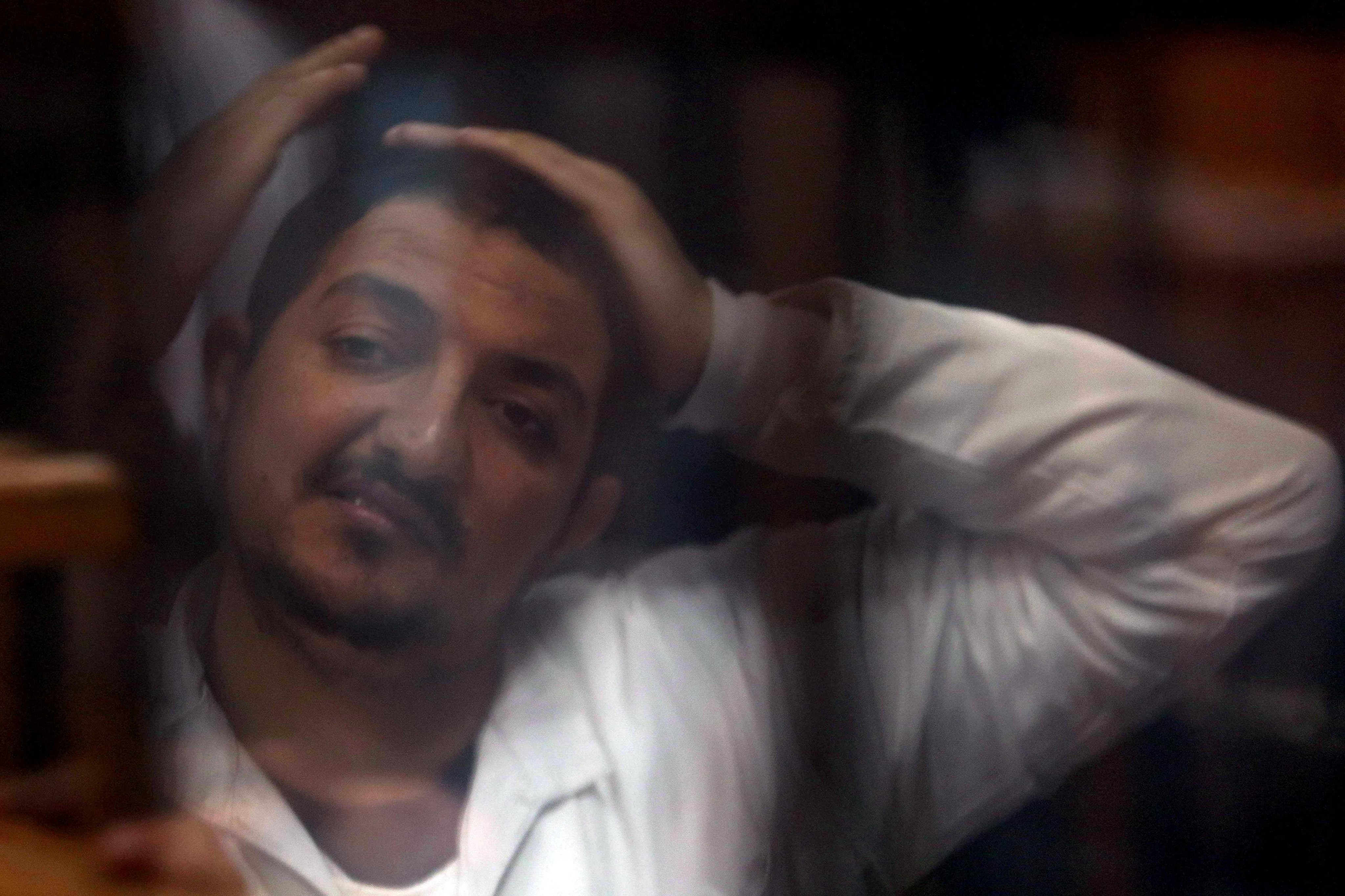 One of the 10 defendants belonging to Egypt’s outlawed Muslim Brotherhood during the trial at the Tora courthouse complex in southeastern Cairo, Egypt on January 30. Photo: AFP