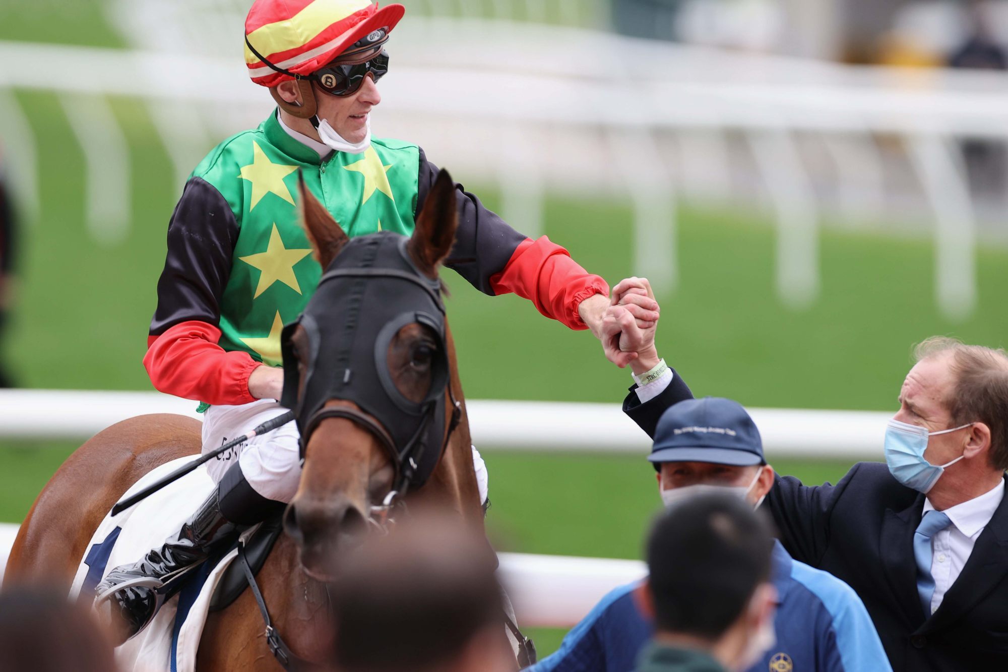 Jockey Blake Shinn and trainer Richard Gibson celebrate Cordyceps Six’s victory.