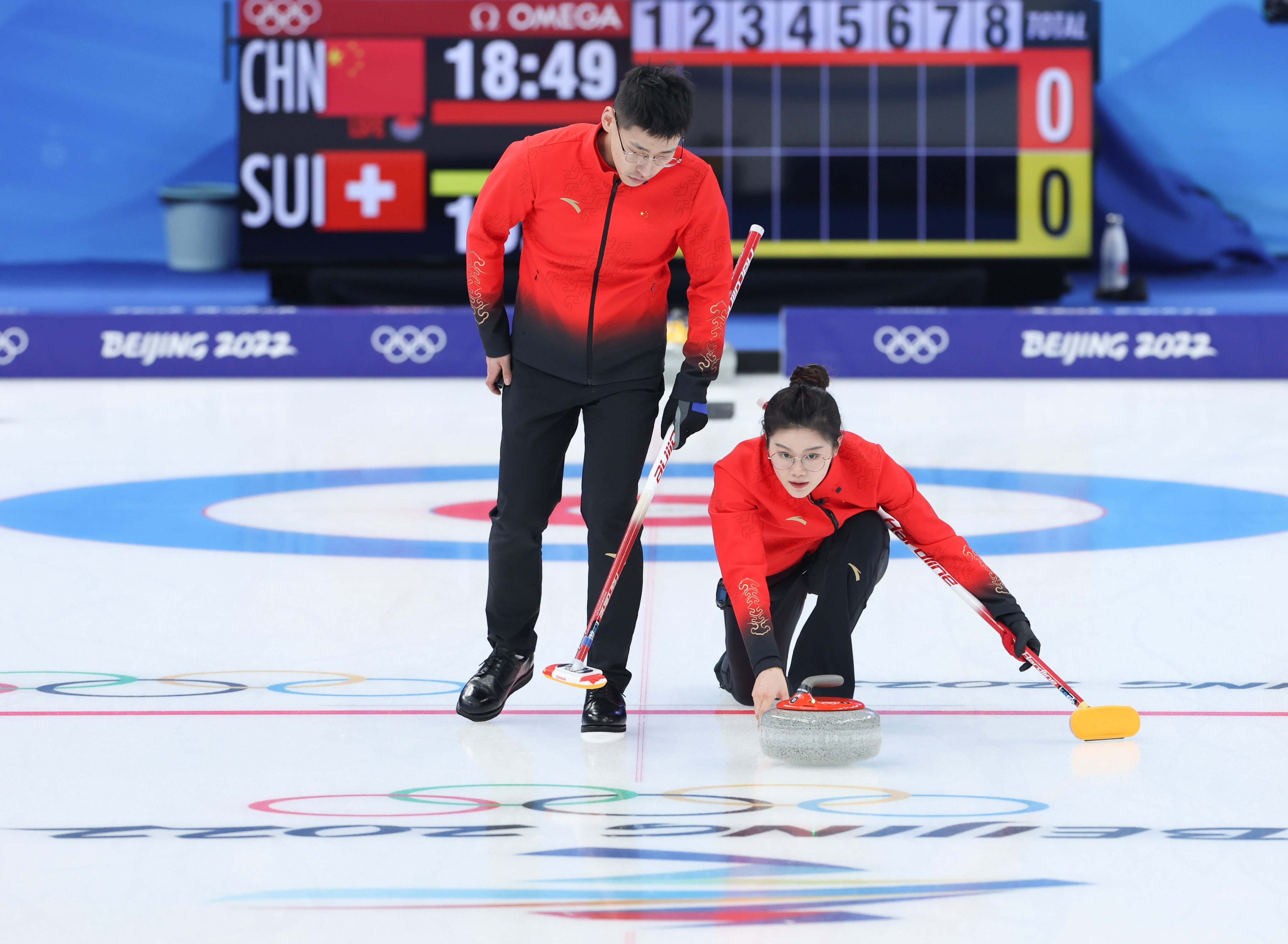 China’s Fan Suyuan (right) and Ling Zhi compete during the curling mixed doubles round robin session of the Winter Olympics. Photo: Xinhua