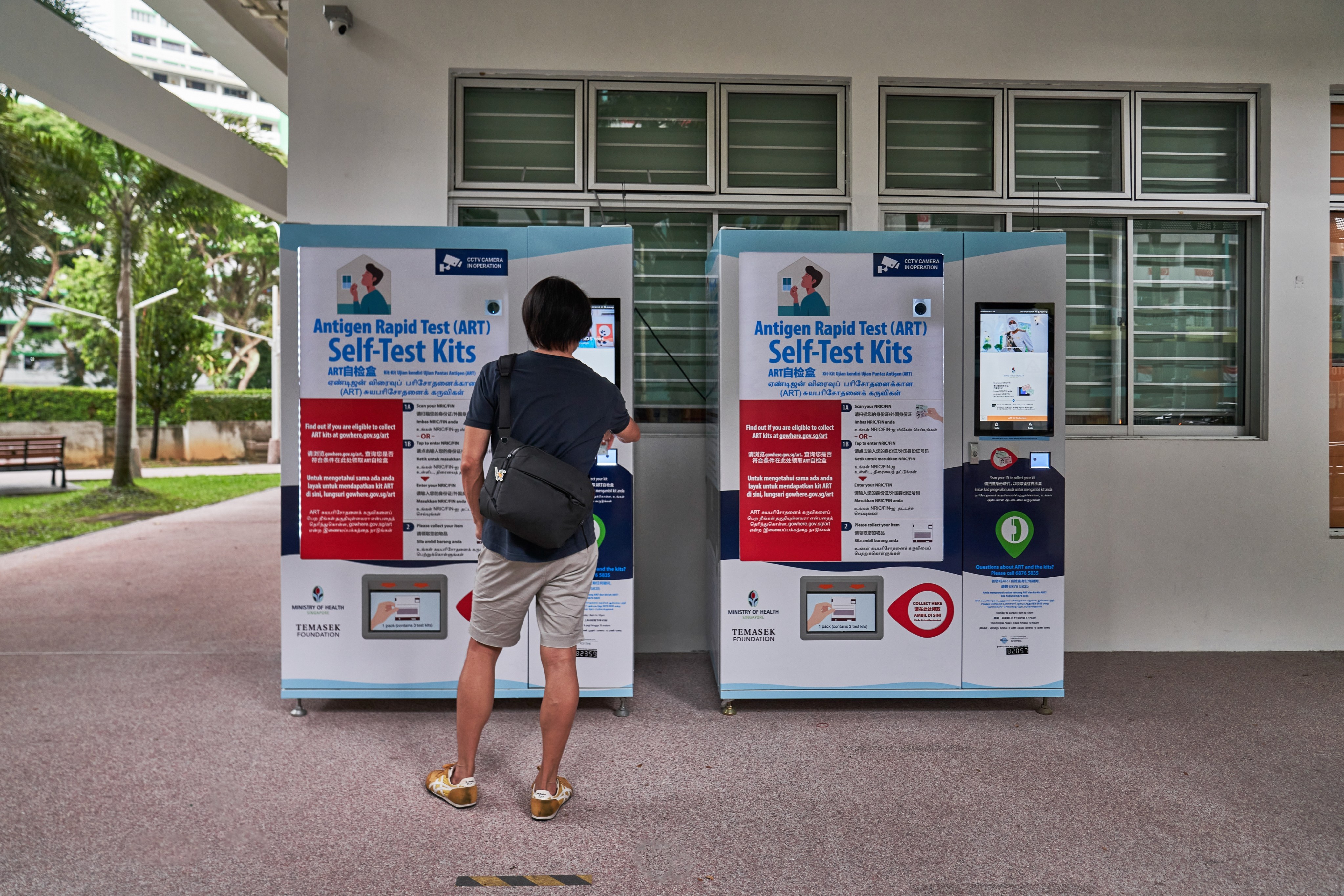 A resident at an ART self-test kits vending machine in Singapore. File photo: Bloomberg