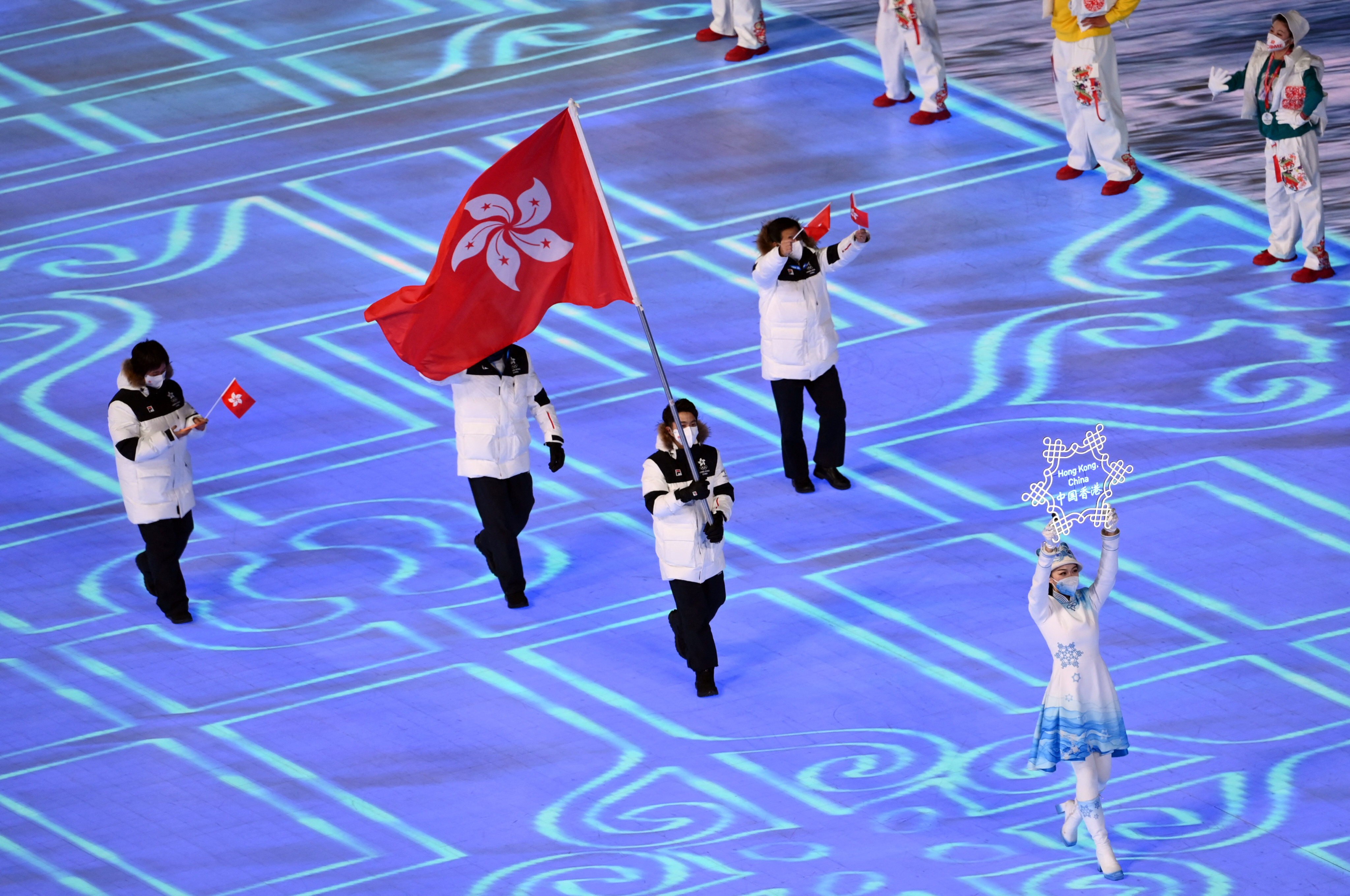 Hong Kong flag-bearer Sidney Chu with national team representatives at the 2022 Beijing Olympic Games opening ceremony. Photo: Reuters   