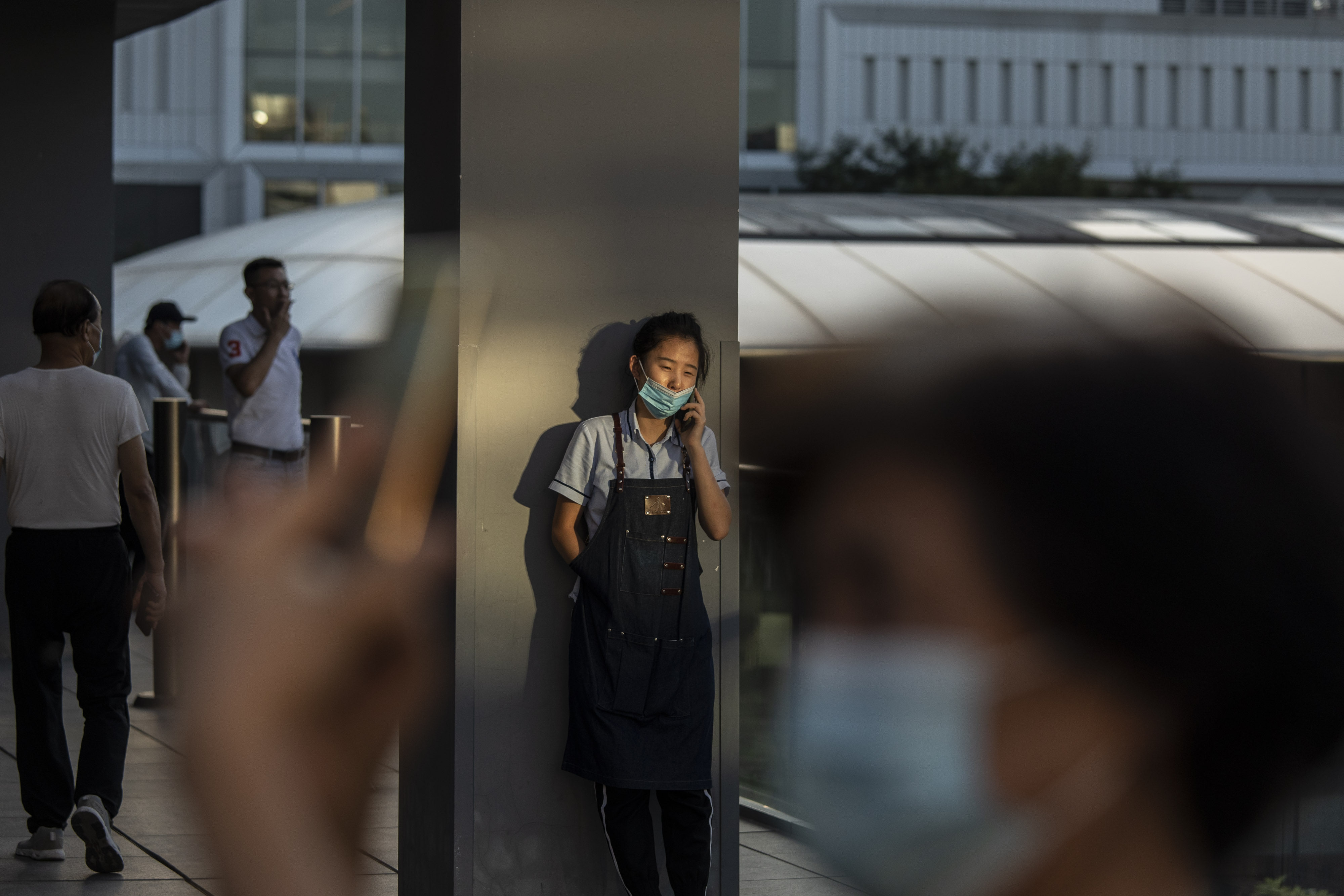 A young worker takes a break in Beijing, China, on August 25, 2021. A Stanford study found that China ranks low globally for social mobility. Photo: Bloomberg