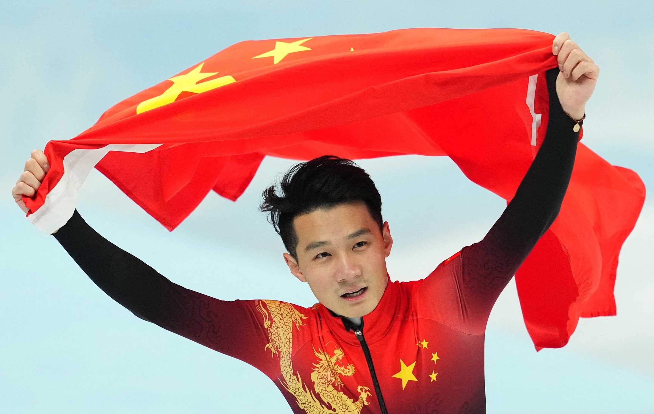 China’s Ren Ziwei celebrates after winning gold in the men’s 1,000m short-track speedskating. Photo: Reuters