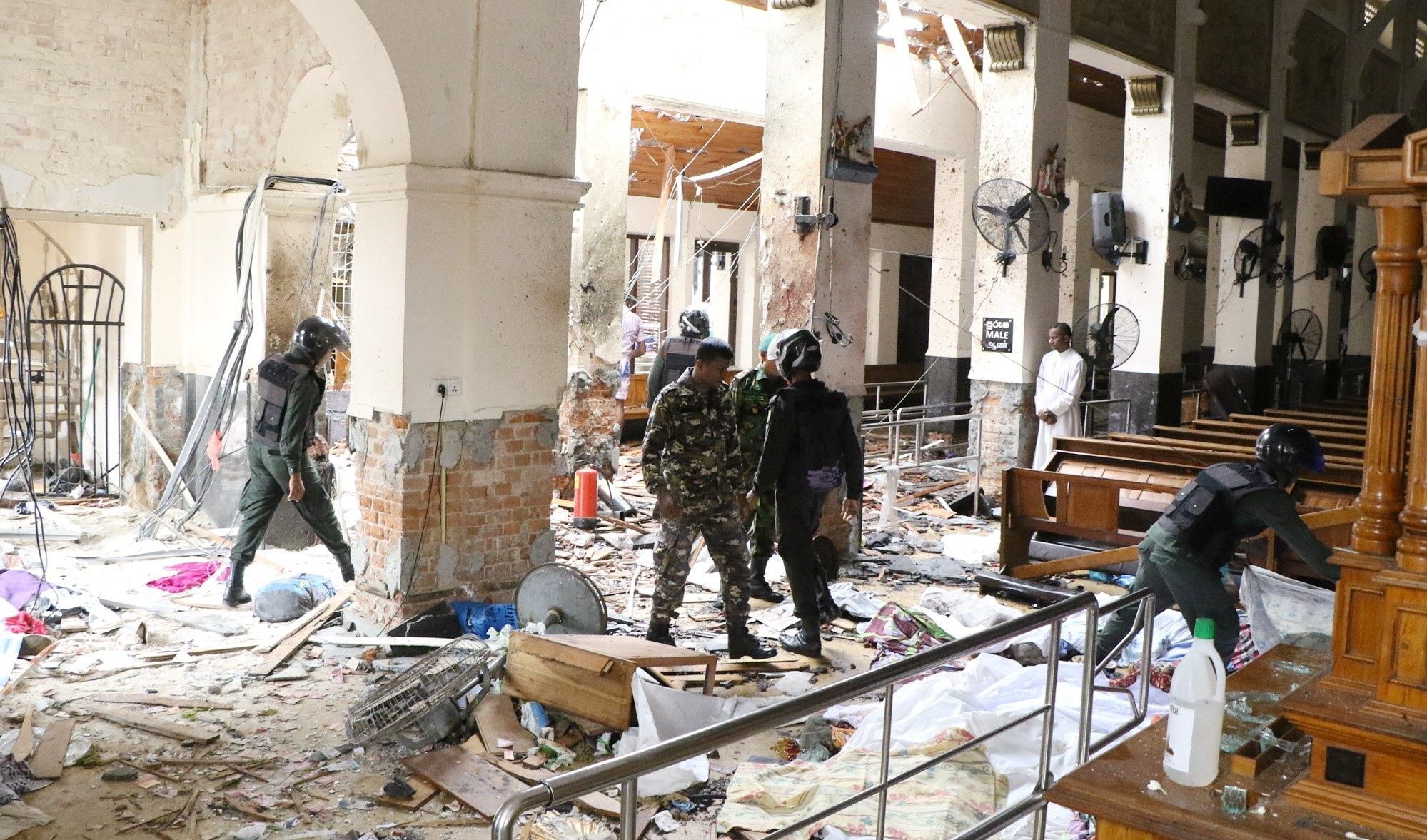 Security forces inspect a church hit by a bomb in Colombo, Sri Lanka in April 2019, when almost 300 people were killed in Easter Sunday blasts. Now a Sri Lankan court has ordered the release of a lawyer arrested over his alleged ties to the bombings and held for nearly two years on charges rights groups say lacked evidence. Photo: Getty Images