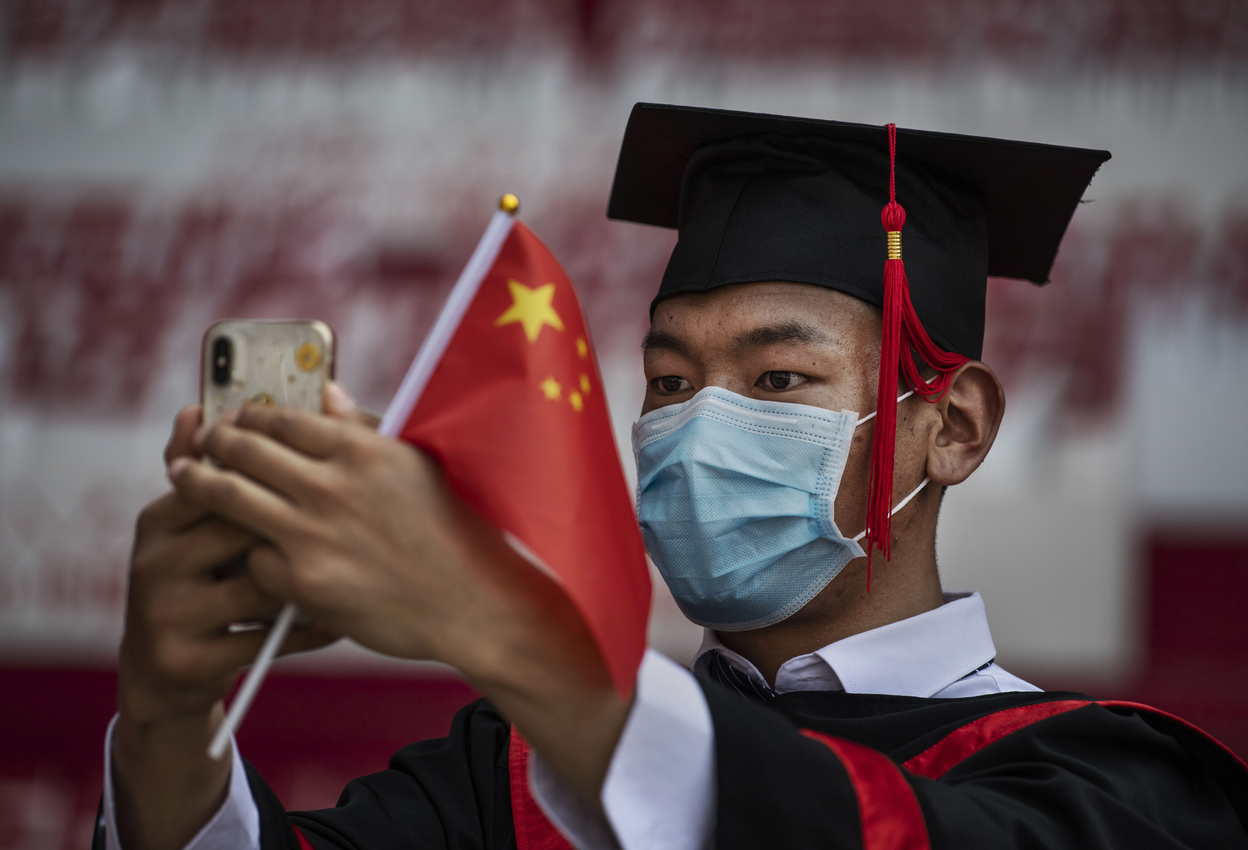 Many of China’s university graduates are opting to take their time before entering the workforce, while others are forgoing high-paying private positions for less-demanding civil service positions. Photo: Getty Images