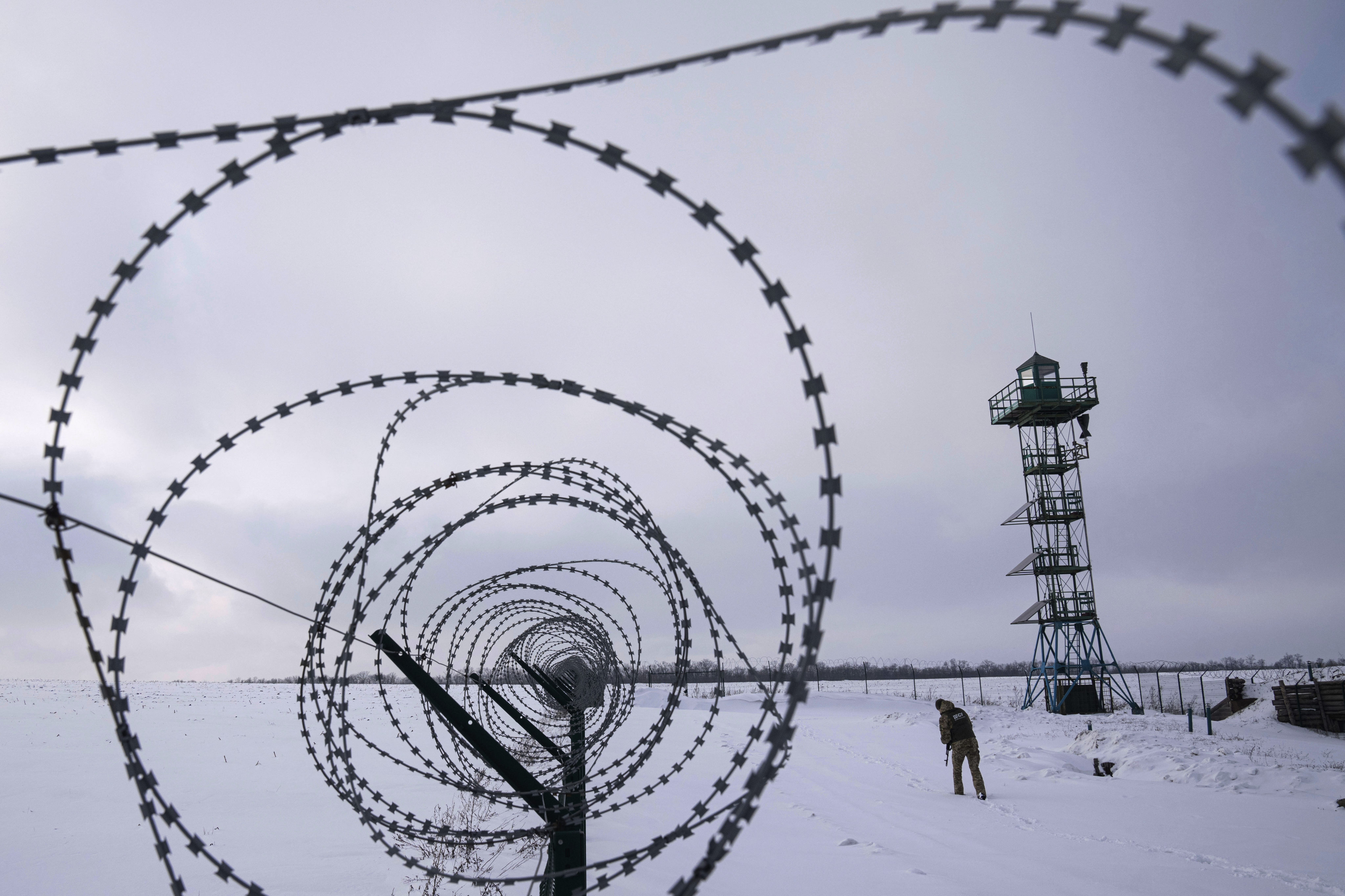 A Ukrainian guard patrols the border with Russia in Ukraine’s Kharkiv region on February 2. Fears of a Russian invasion are growing as President Vladimir Putin accuses the US and its allies of threatening Russia’s security by refusing to ban Ukraine from joining Nato. Photo: AP