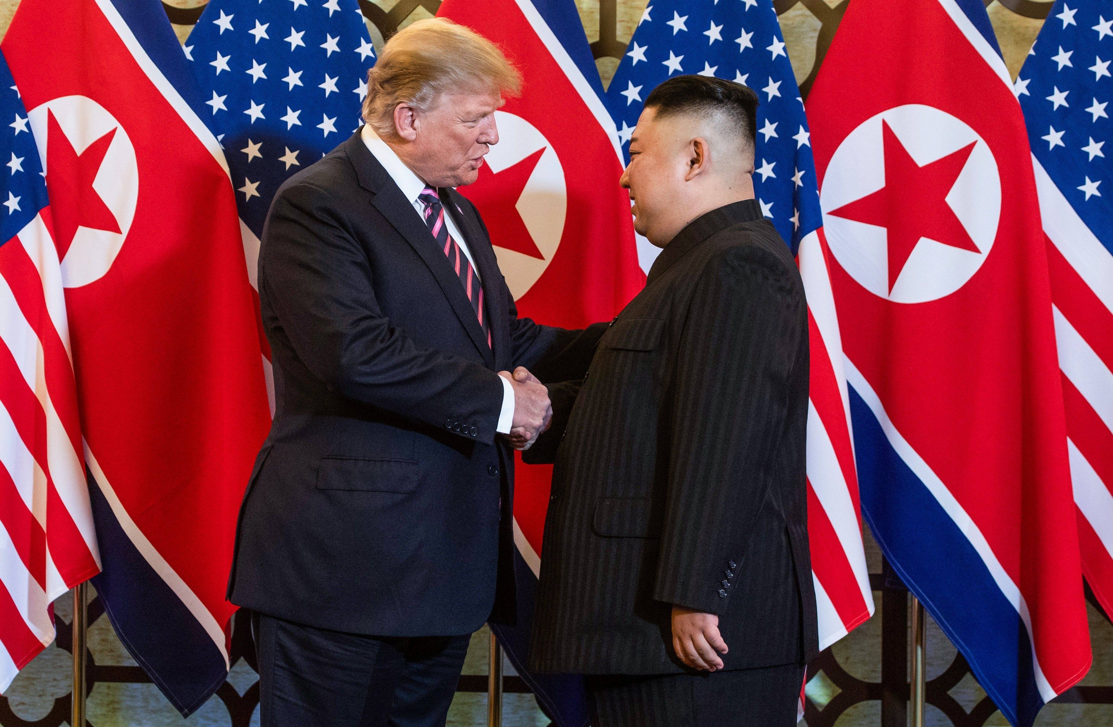 US President Donald Trump shakes hands with North Korea’s leader Kim Jong-un in Hanoi in February 2019. Photo: AFP