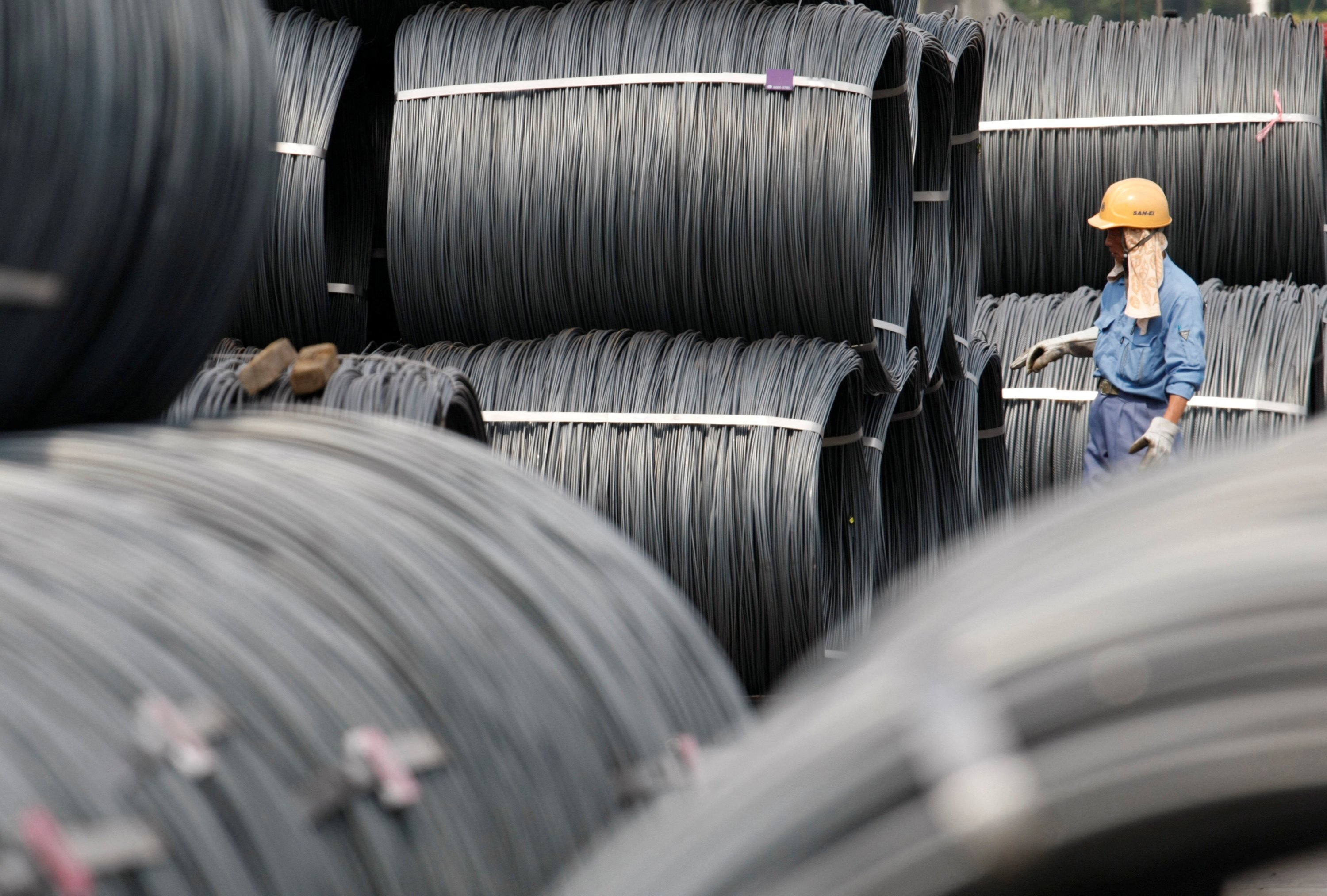 A worker checks the coils at a steel collection facility in Tokyo in August  2009. Photo: Reuters