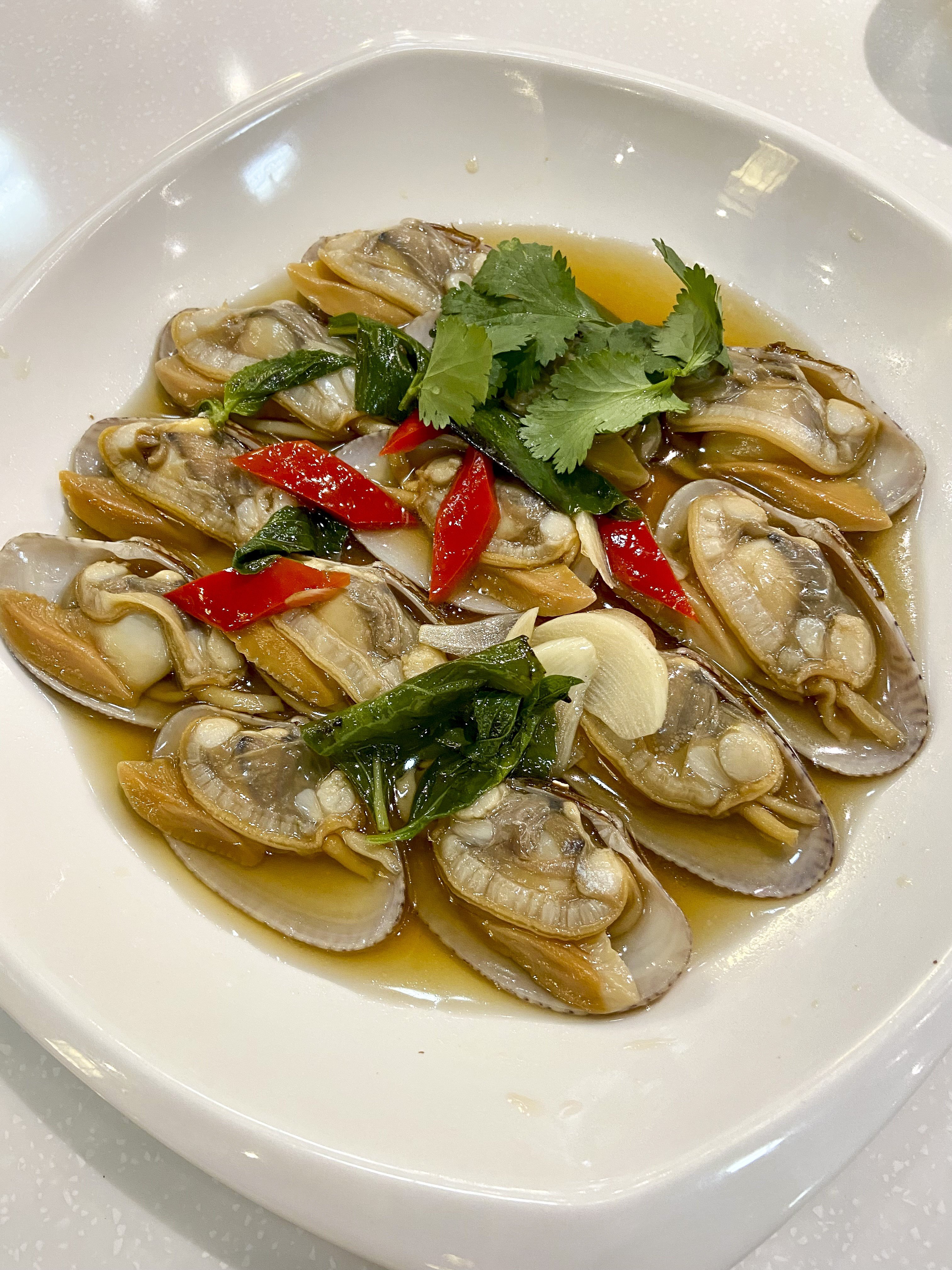 Poached clams in fish sauce got the meal off to a delicious start at Best Chiu Chow Restaurant in Wan Chai. Photo: Susan Jung