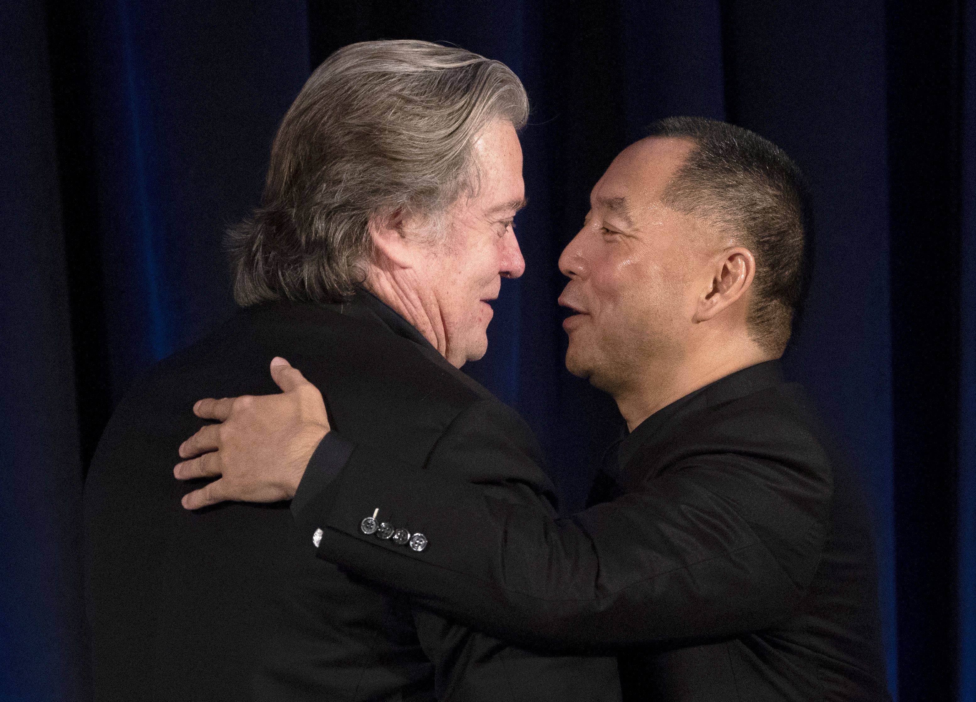 Former White House chief strategist Steve Bannon greets Chinese billionaire Guo Wengui, right, before a news conference in 2018. Photo: AFP