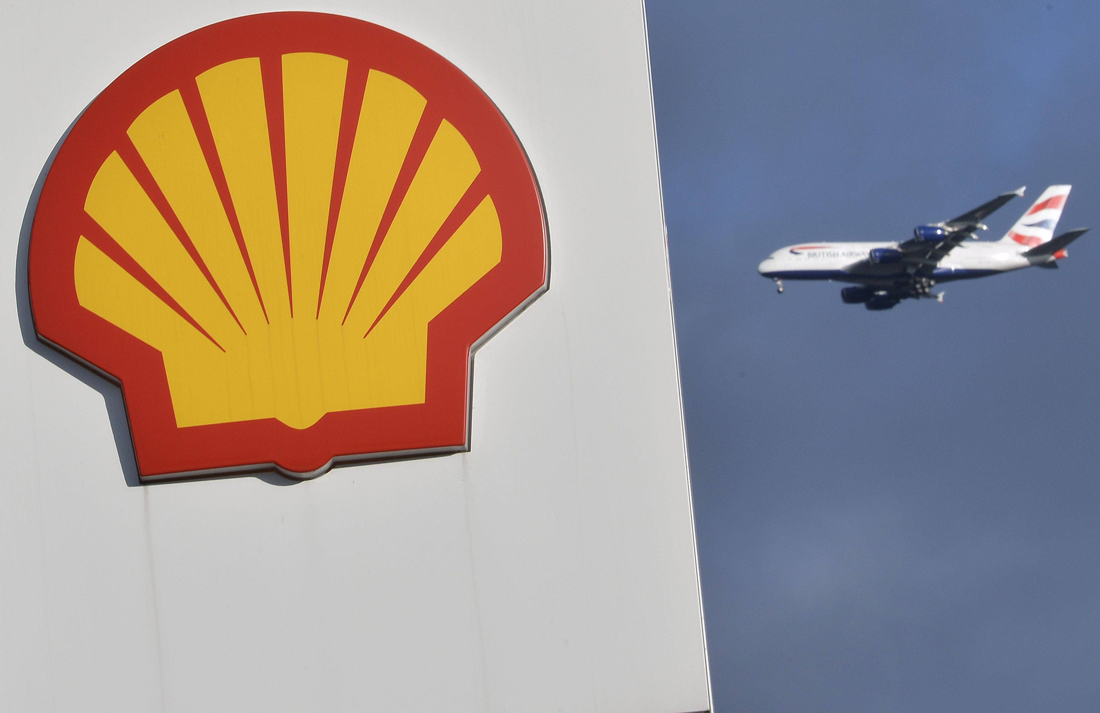 A Shell logo at a fuel station with a plane behind. Photo: Reuters