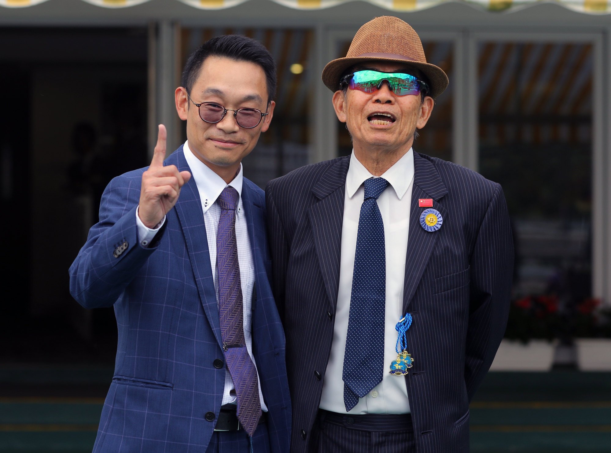 Jimmy Ting (left) celebrates his first winner as a trainer with Brian Kan. Photo: Kenneth Chan