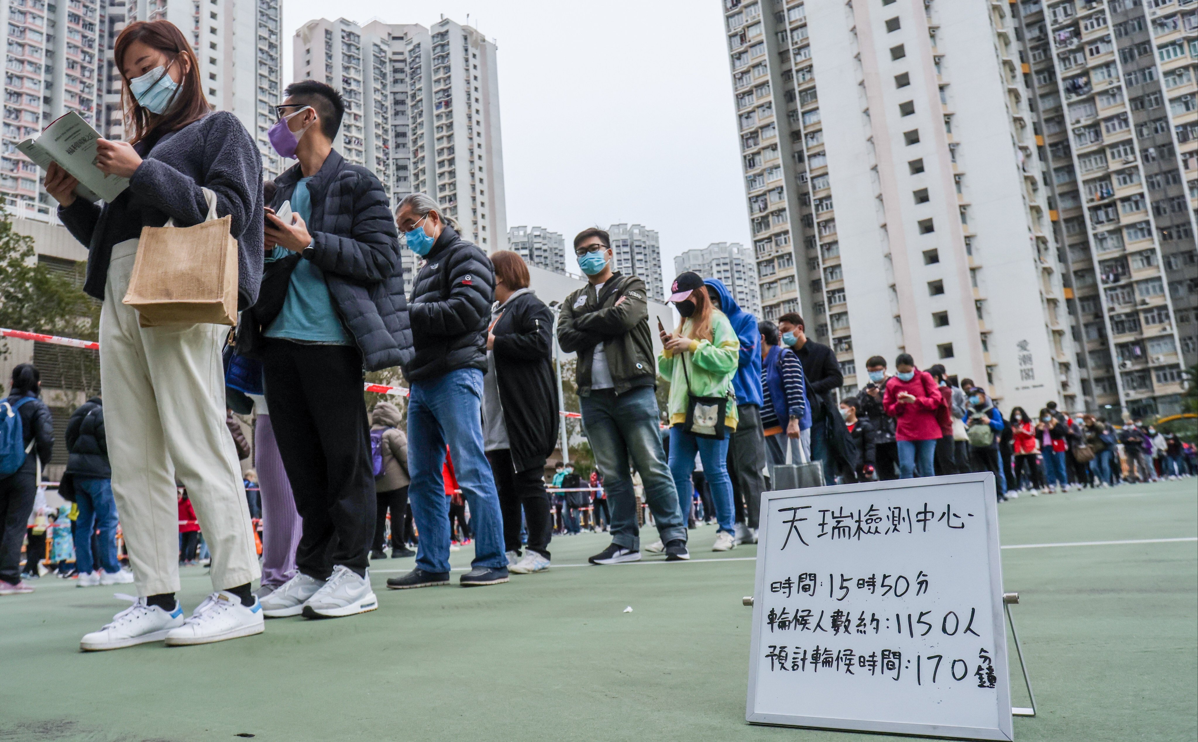 Local residents and workers queue up for mandatory Covid-19 testing in Tin Shui Wai. Photo: May Tse