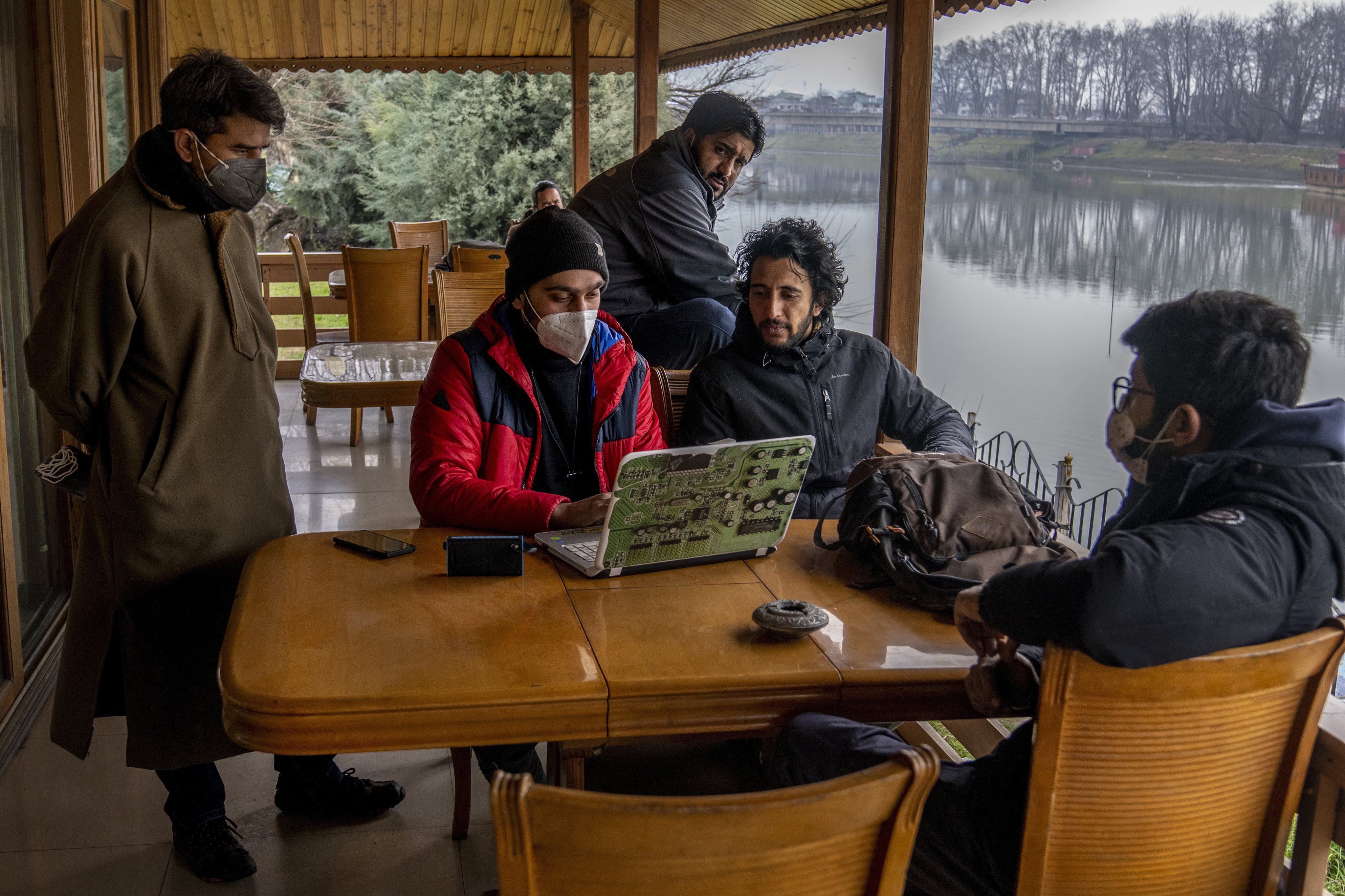 The detention of Fahad Shah (centre sitting) has gripped Kashmir’s small community of journalists with fear. File photo: AP