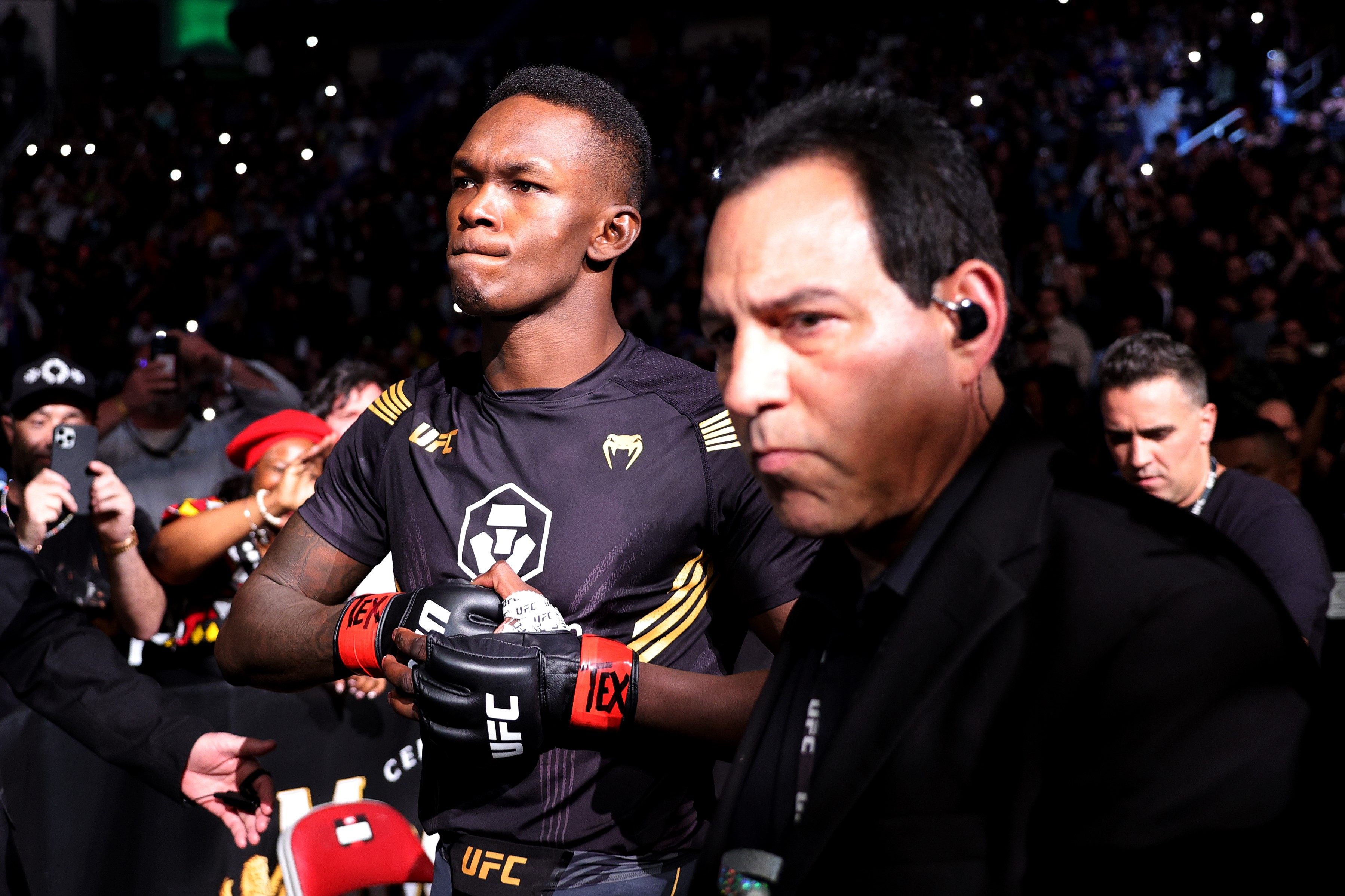 Israel Adesanya of Nigeria enters the octagon for his middleweight championship fight against Robert Whittaker at UFC 271. Photo: Carmen Mandato/Getty Images/AFP

