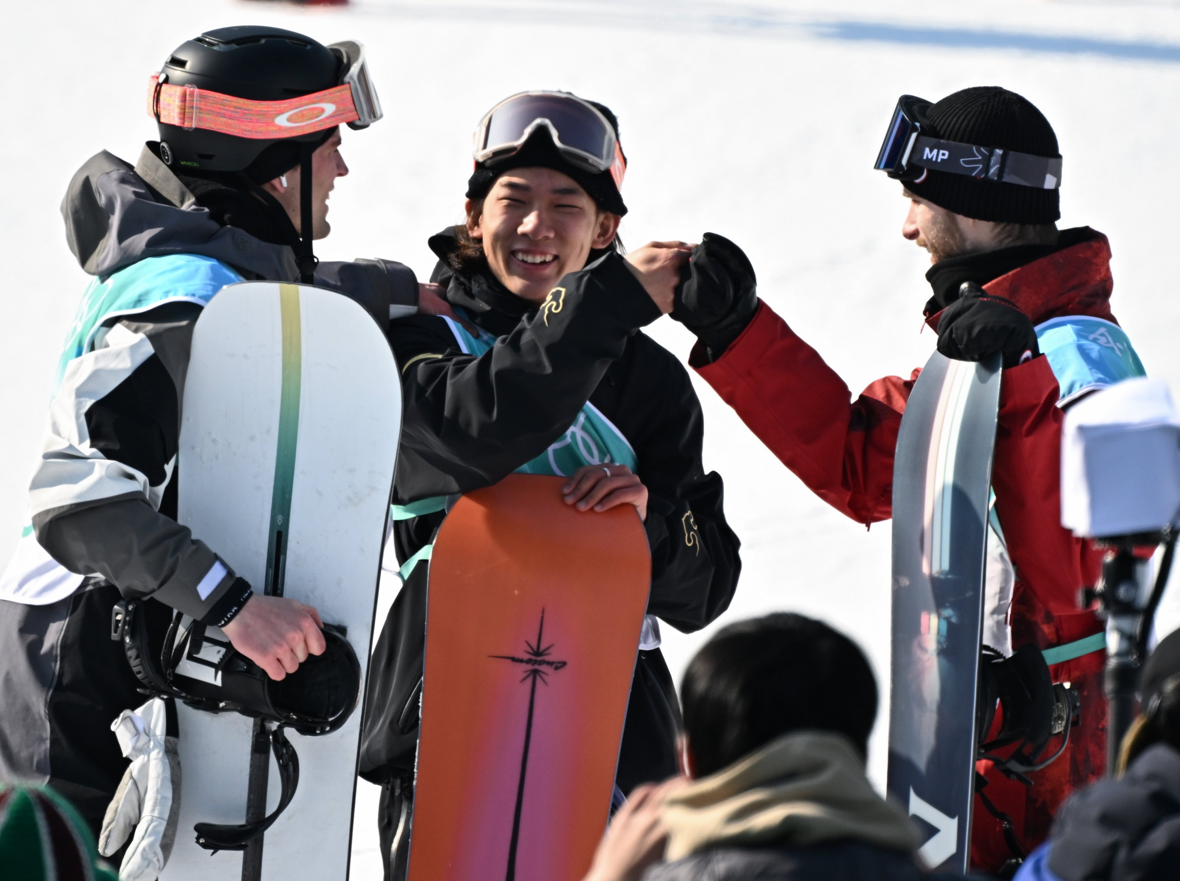 China’s Su Yiming is congratulated by fellow snowboarders after winning gold in the men’s big air event at the Winter Olympics. Photo: Xinhua